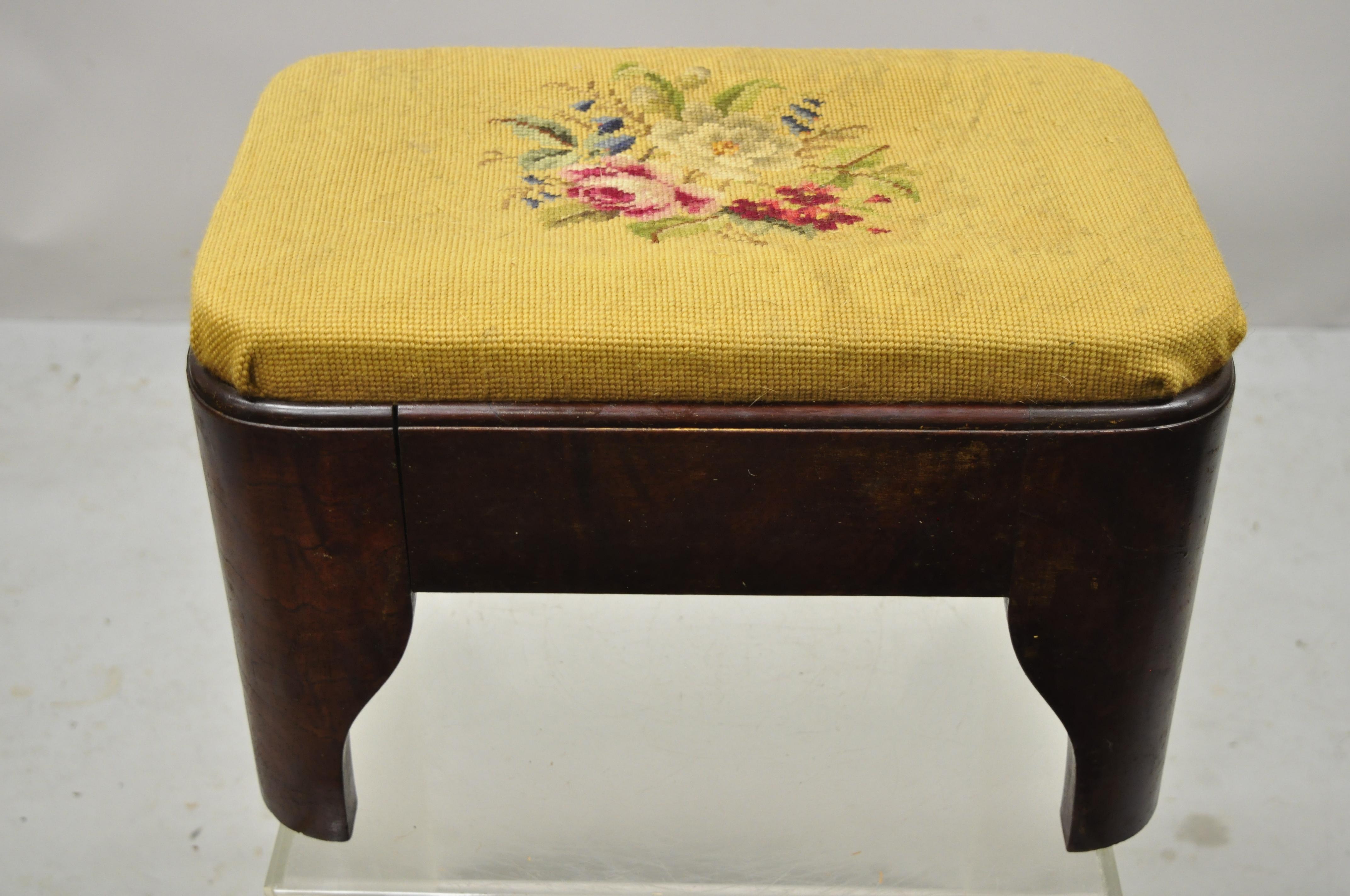 Antique Victorian Empire crotch mahogany floral needlepoint footstool ottoman. Item features beautiful wood grain, very nice antique, great style and form. Circa 19th century. Measurements: 11
