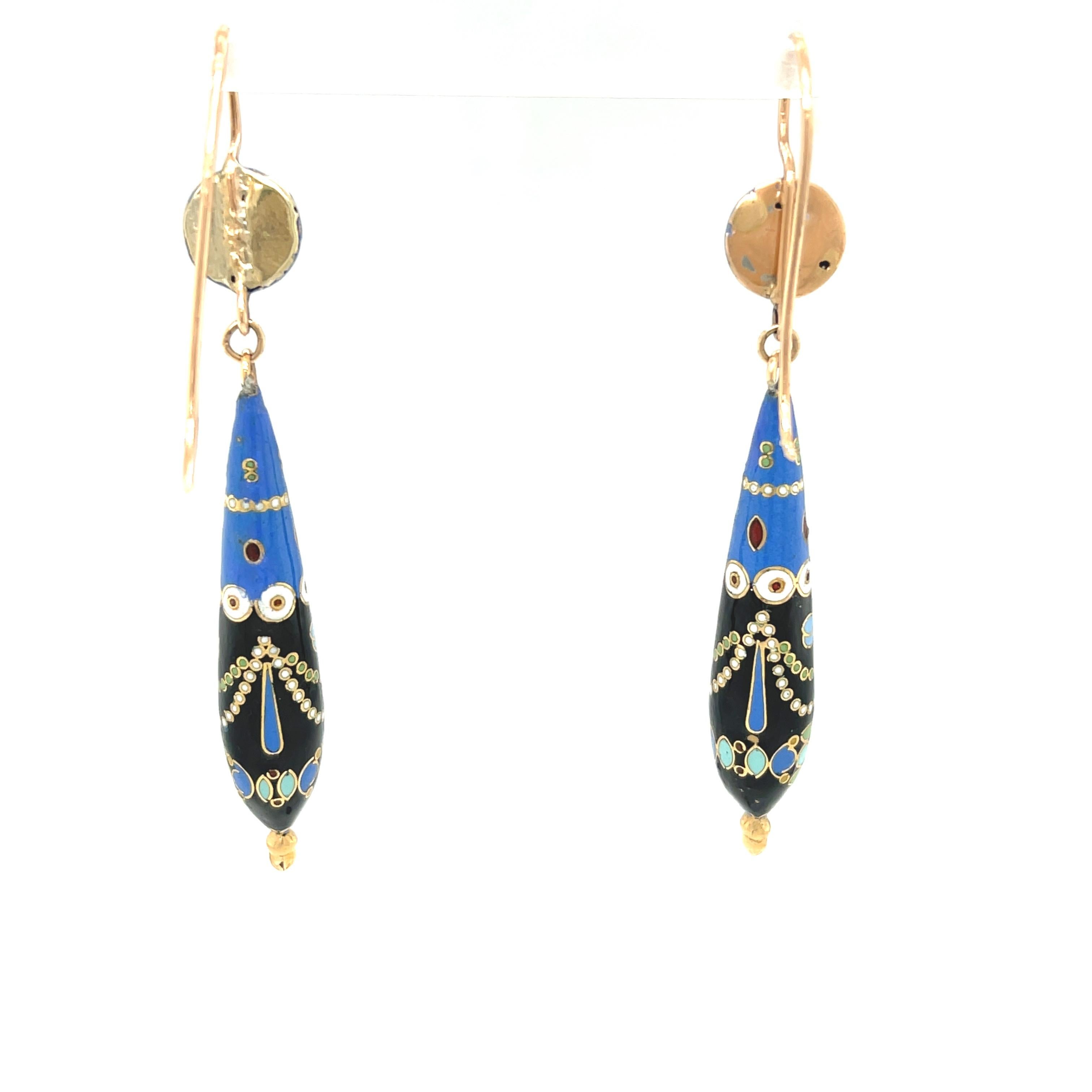 Antique Victorian 14k gold blue enamel dart earrings circa 1900. These charming Swiss enamel style blue white and black enamel dart earrings are unique in style and color combination. The dart pendants are suspended from a half bead top and the