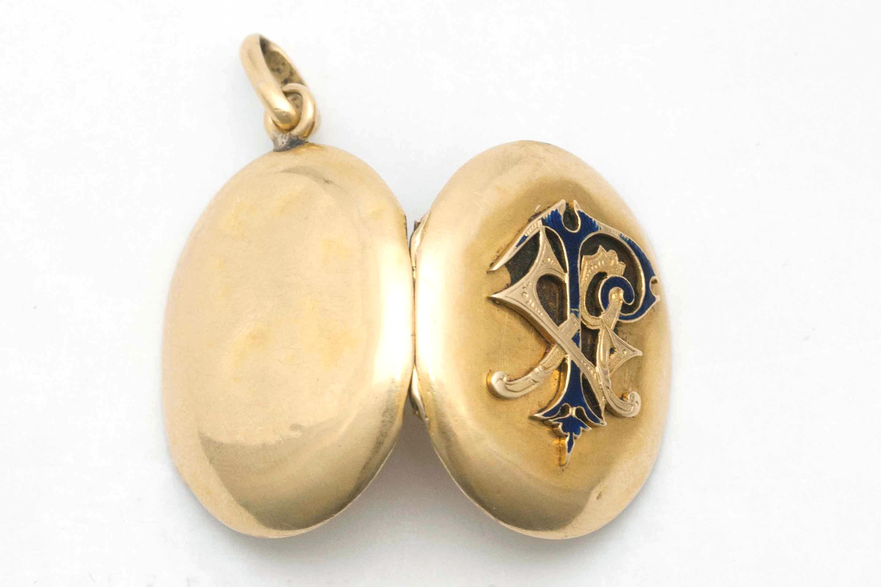 The Marion Locket. An antique Victorian memento to carry pictures of cherished ones. Circa 1910, finely tooled guilloche enamel monogram pendant in lovely solid 14K gold. This will be a family heirloom for many more generations to come.

Height