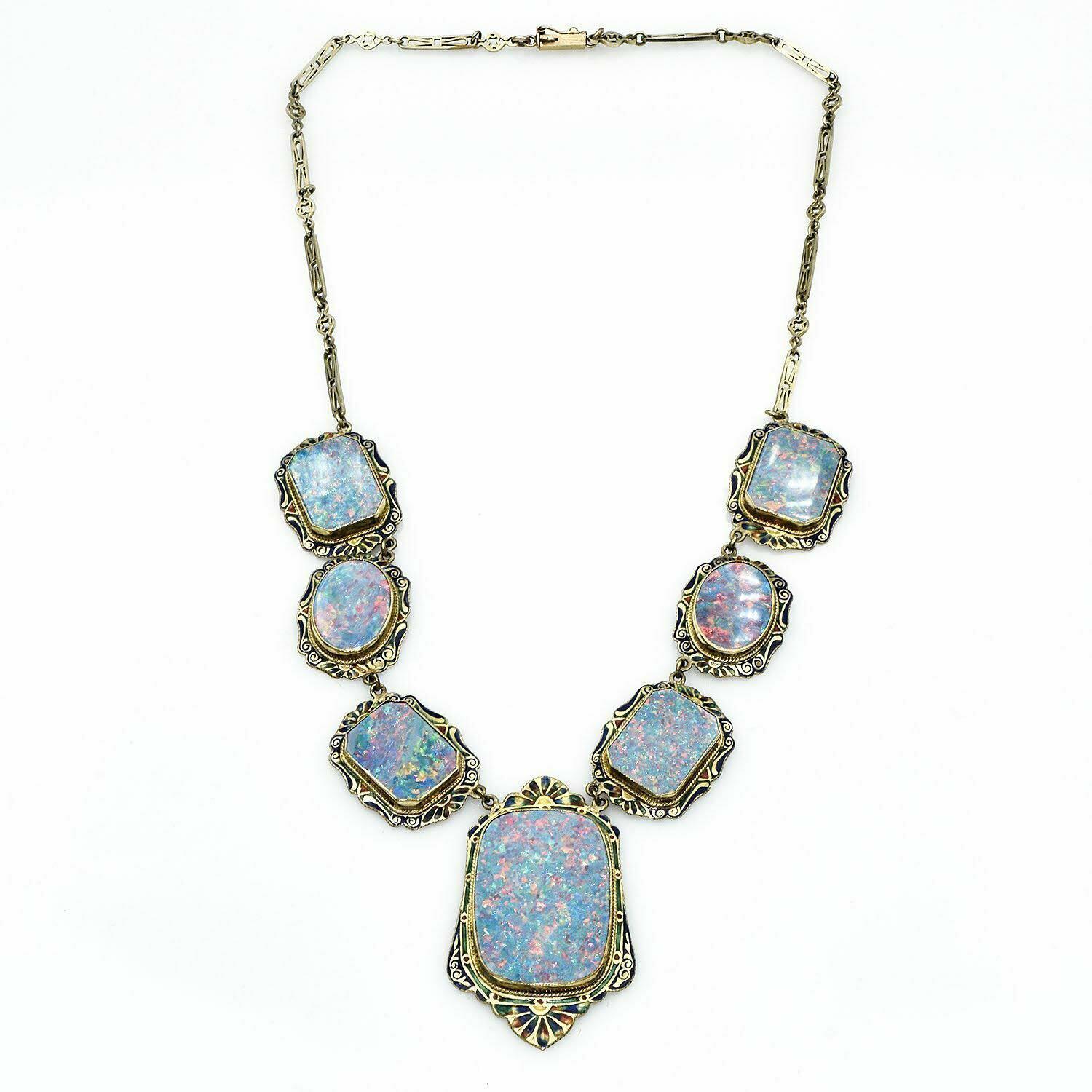 Material: 14K Yellow Gold
Weight: 34.6 Grams
Stone: Opals 11.5 x 16.2 mm - 19.7 x 27.5 mm
Necklace Length: 17 Inches
Hallmark: 14K