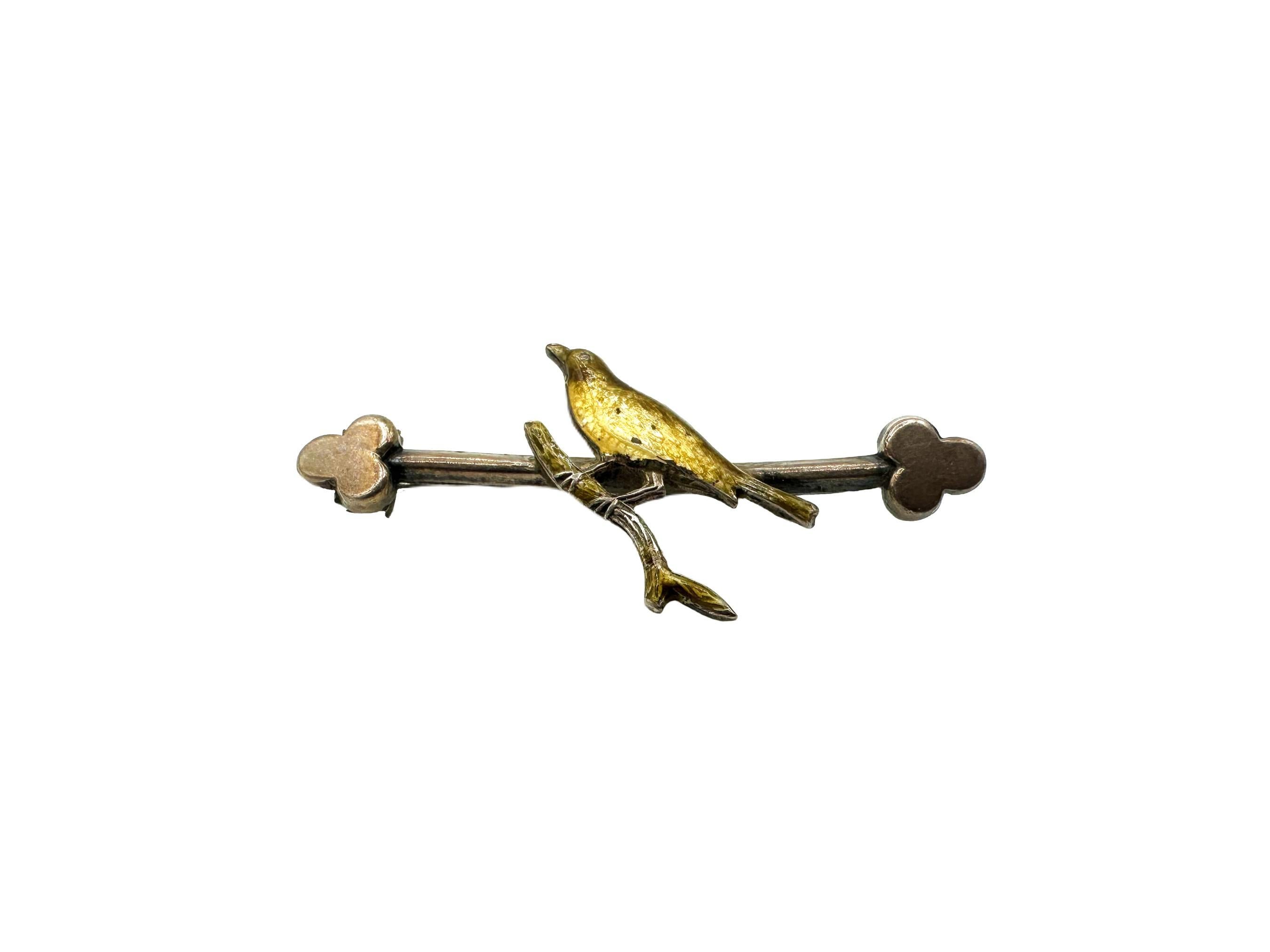 This hand-crafted antique Victorian brooch was forged from sterling silver and features a sweet enameled yellow bird perched on a silver branch. During the Victorian era, bird watching and aviaries grew quite fashionable due to the work of