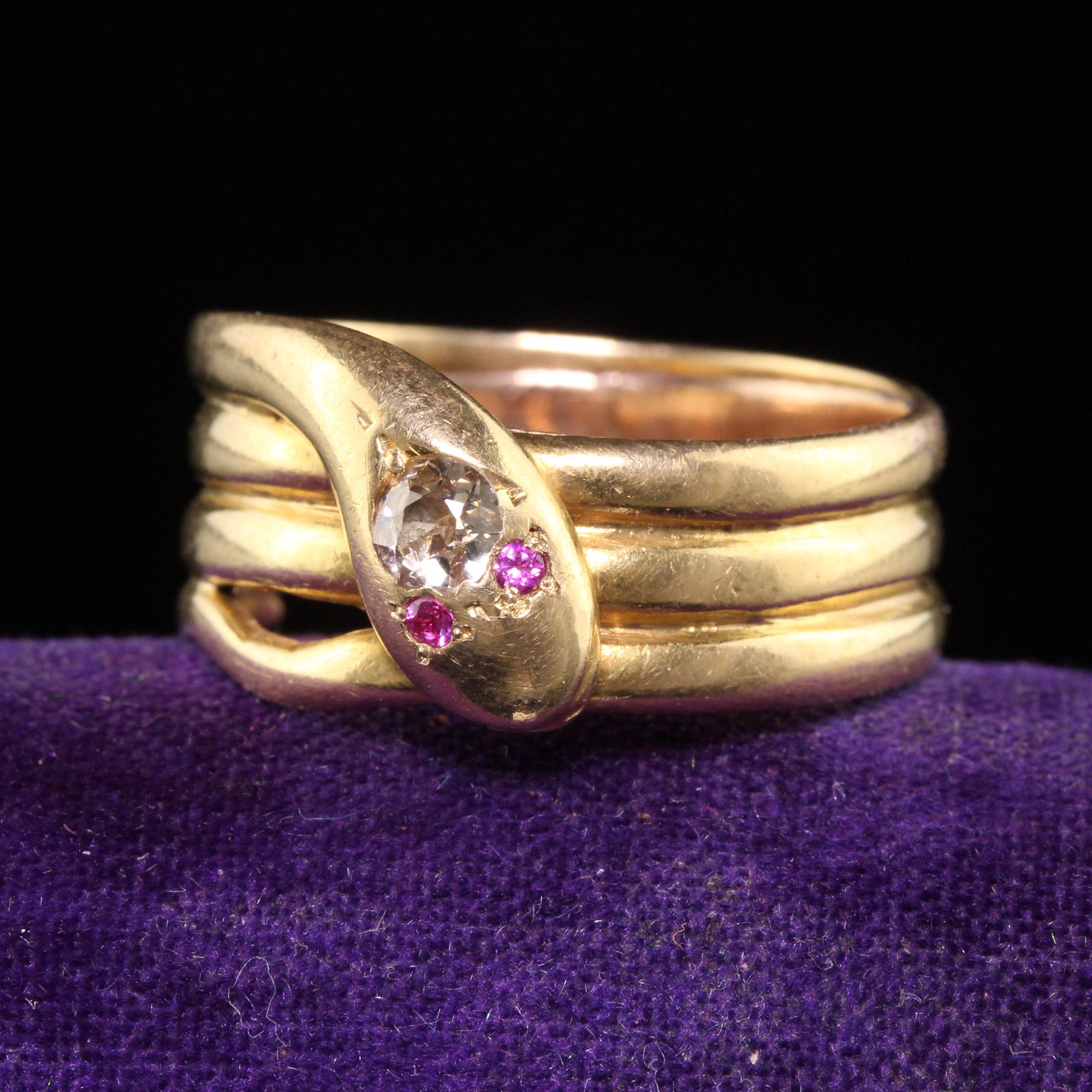 Beautiful Antique Victorian 18K Yellow Gold Old Mine Diamond Wide Snake Ring. This beautiful snake ring is crafted in 18k yellow gold. The head of the snake features a chunky old mine cut diamond on its head with two small rubies as its eyes. The