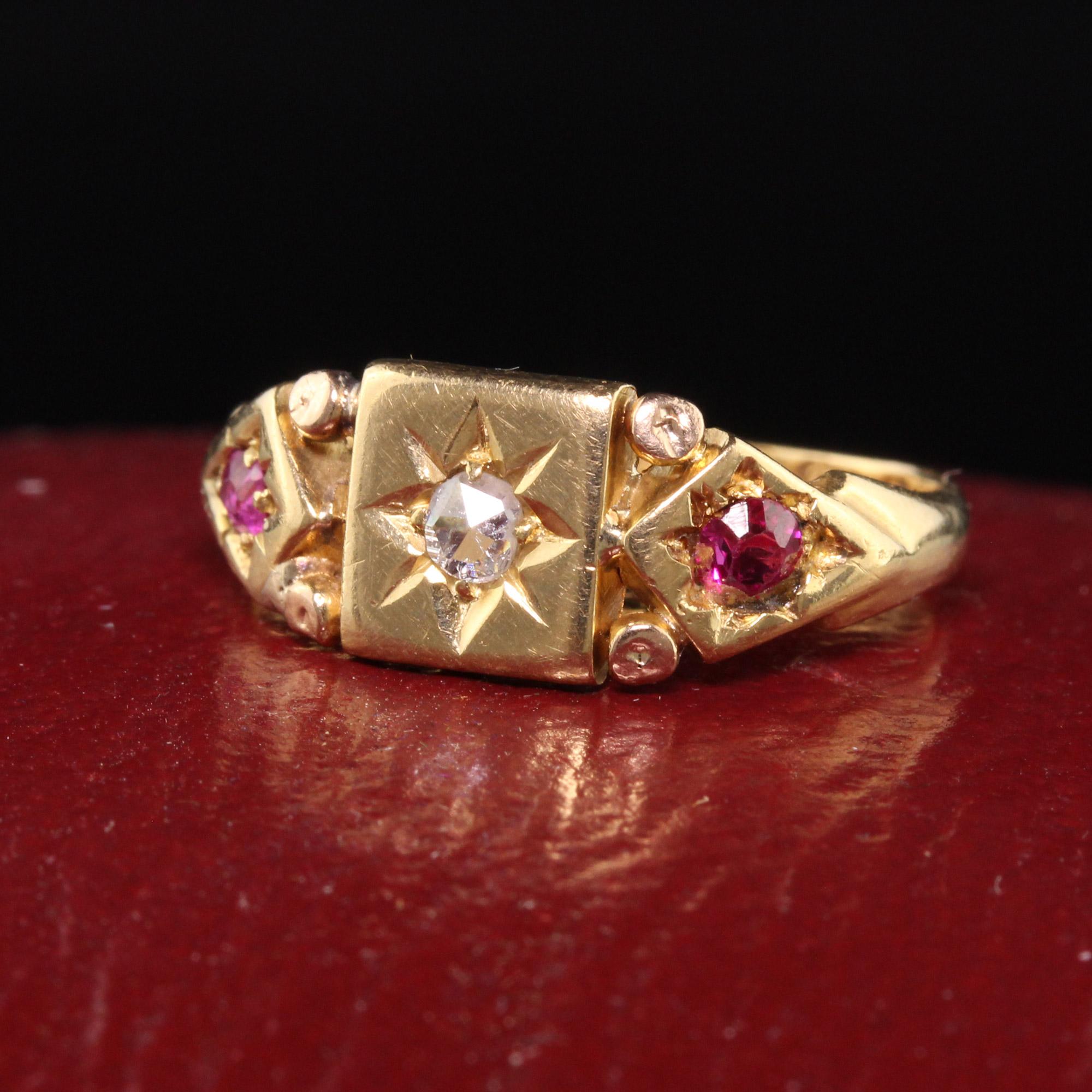 Beautiful Antique Victorian English 18K Yellow Gold Rose Cut Diamond and Ruby Ring. This beautiful Victorian ring is crafted in 18K yellow gold and is made in england. There is a rose cut diamond in the center with 2 natural rubies on the