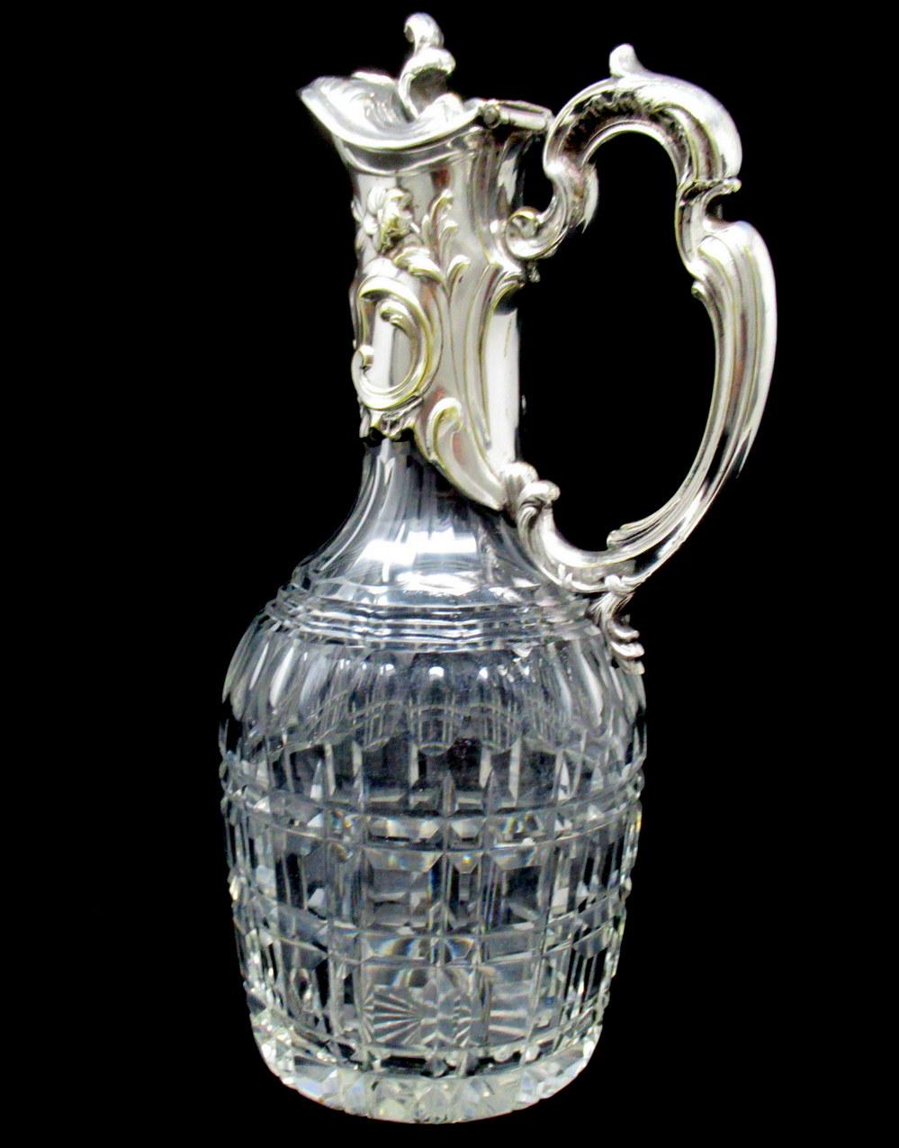 Stunning traditional form early Victorian English silverplated and hand cut full led crystal wine ewer claret jug of outstanding quality and generous proportions. Third quarter of the nineteenth century.

The main outer lower body with unusual