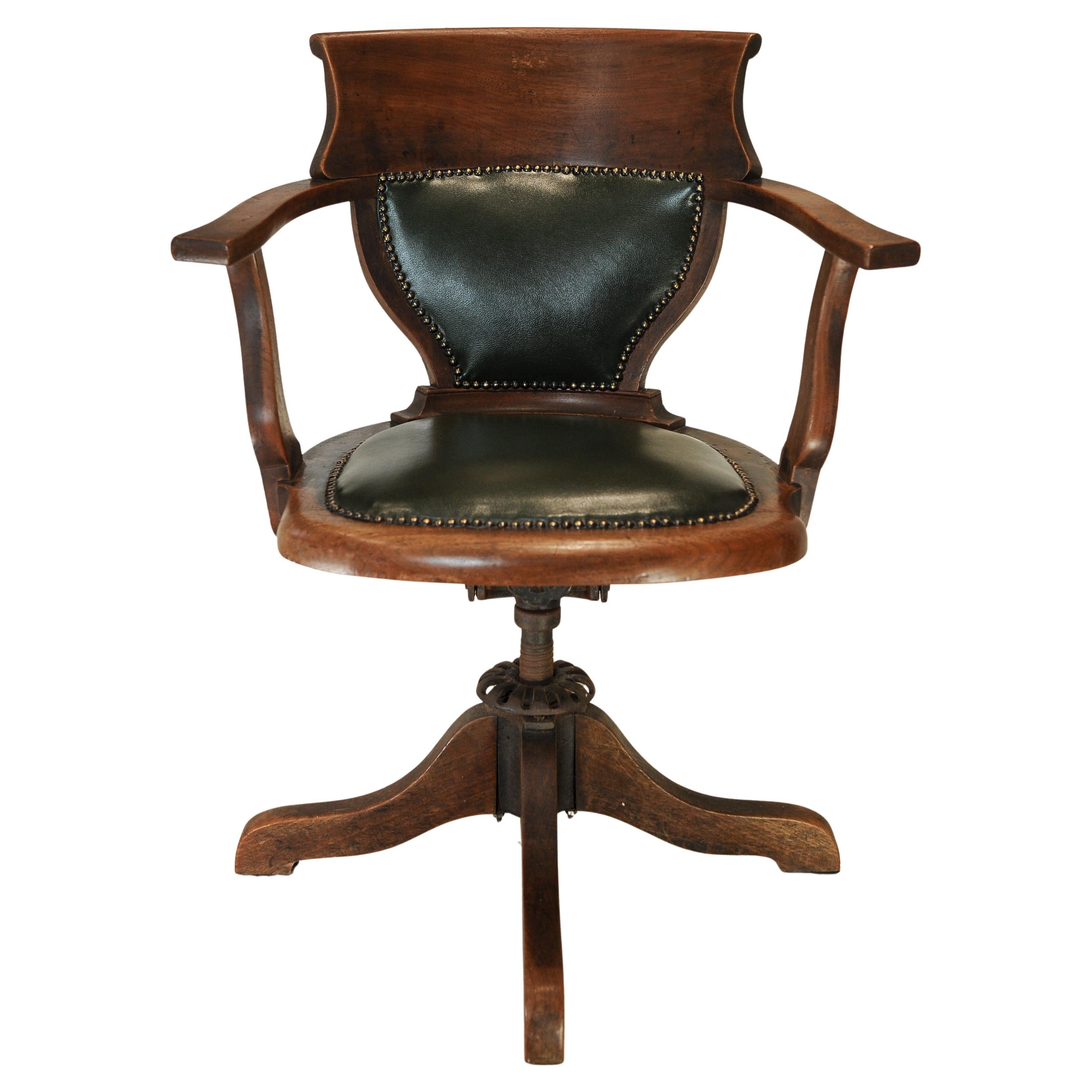 Silla de escritorio giratoria antigua victoriana inglesa de cuero verde y roble siglo XIX en venta