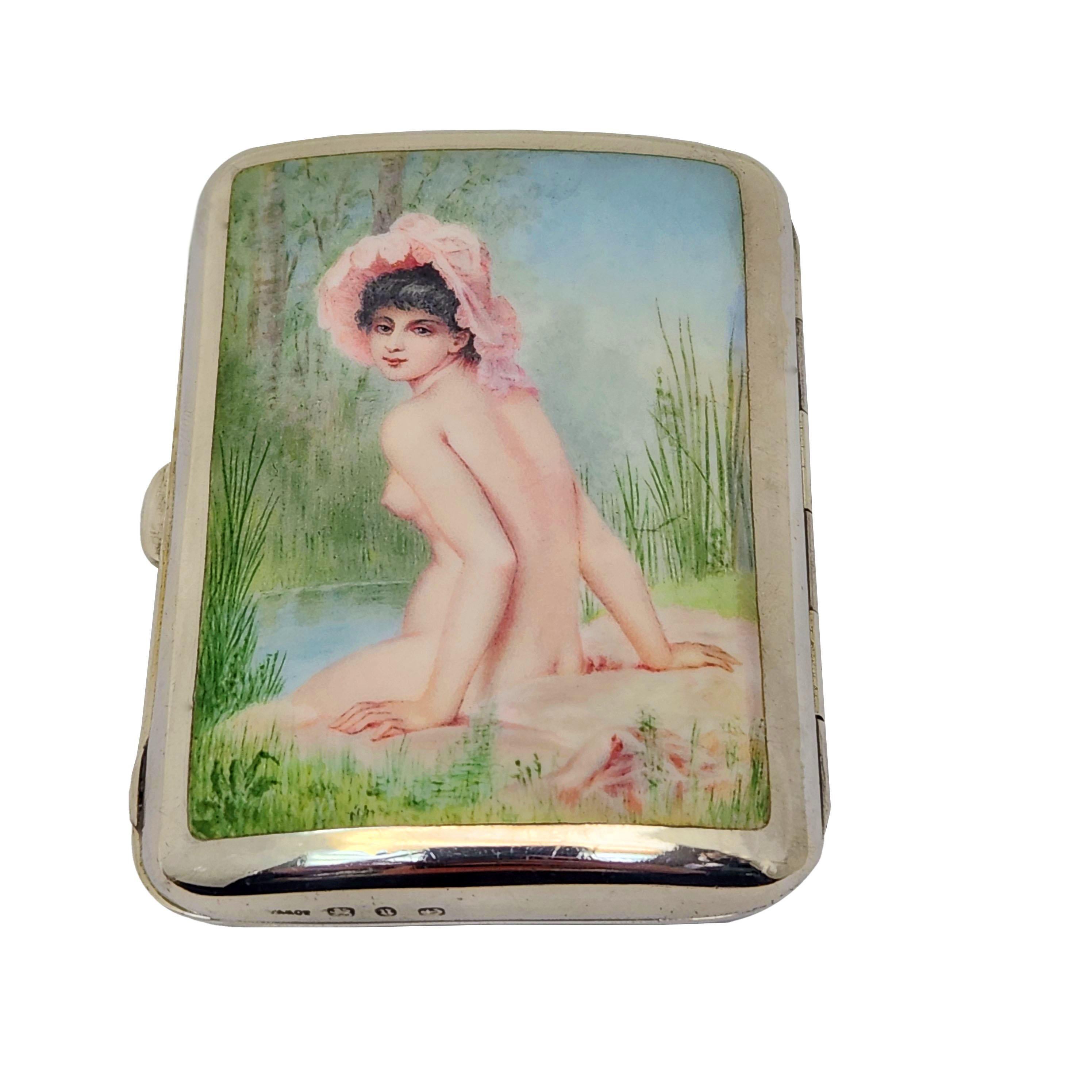 An beautiful Antique Victorian Silver & Enamel Cigarette Case. The Cover of this Cigarette Case had a gorgeous Enamelled Imaged of a naked woman sitting on the banks of a river wearing only an impressive pink hat. Th back of the case has an engraved