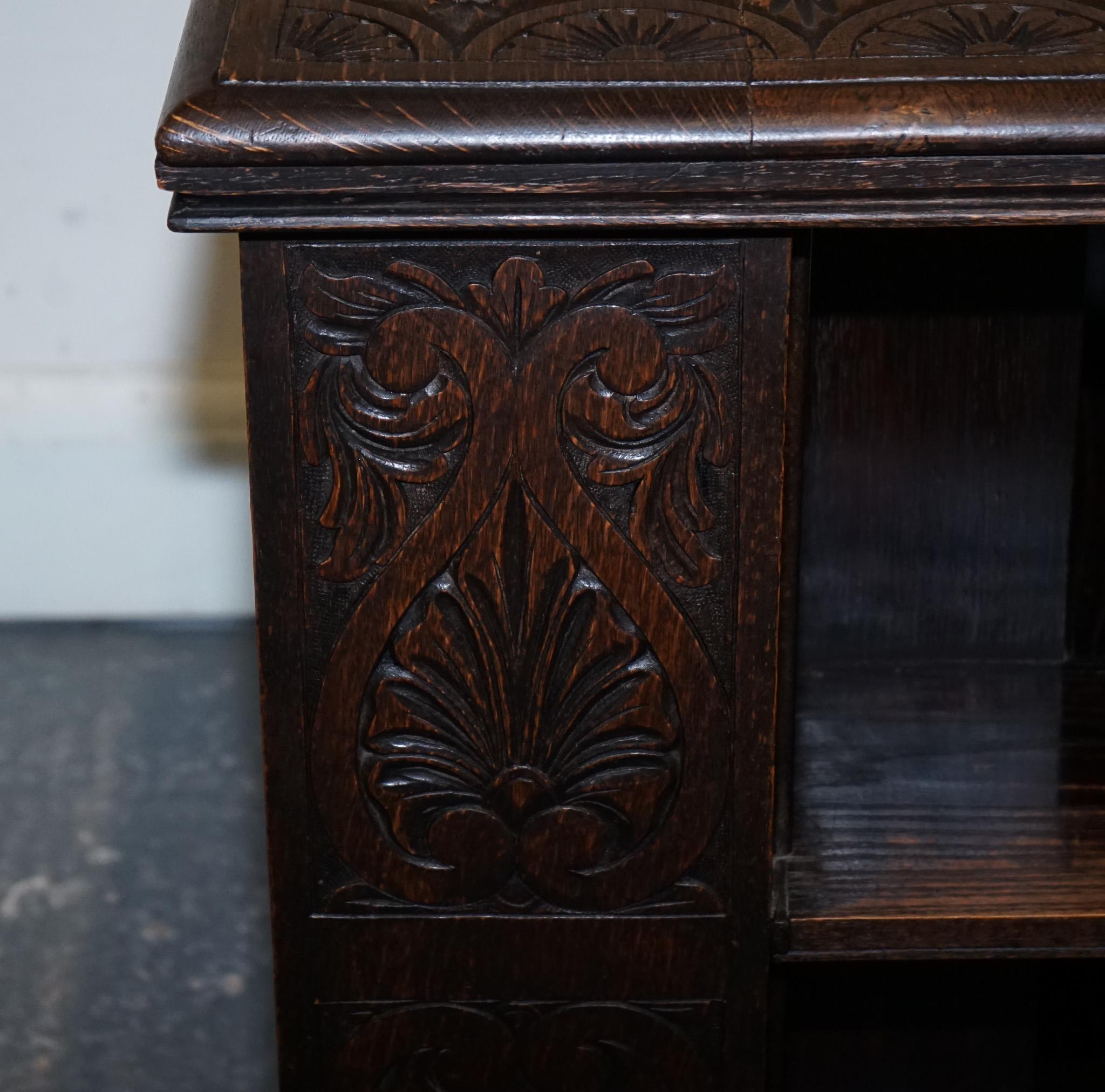 Hand-Crafted ANTIQUE VICTORIAN ENGLISH SOLID OAK CARVED JACOBEAN REVOLViNG OPEN BOOKCASE For Sale