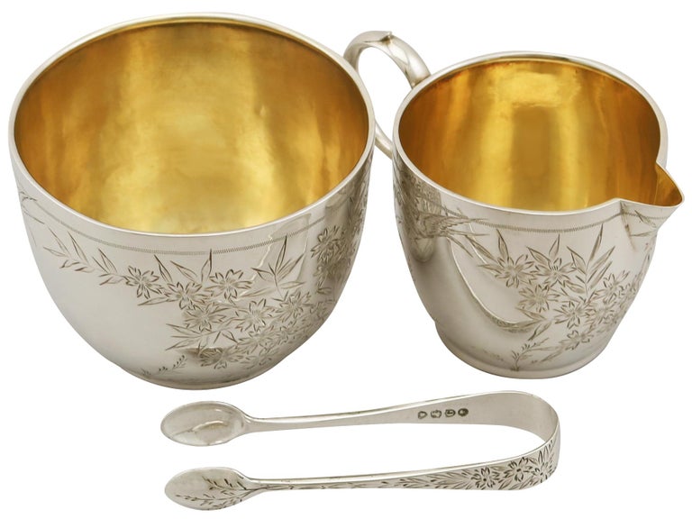 A fine and impressive antique Victorian English sterling silver cream and sugar presentation set - boxed; an addition to our antique teaware collection.

This fine antique Victorian sterling silver afternoon teaware set consists of a cream jug, a