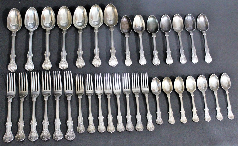A total of 35 pieces of early Victorian sterling silver English flatware by George Adams, London, dated 1878 in a very rare pattern. Ornately decorated and substantial in their composition, these pieces are being offered in 'As Found' condition as