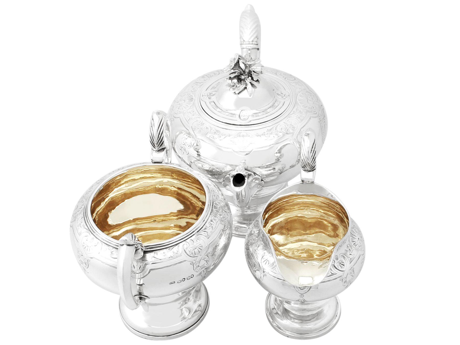 A fine and impressive antique Victorian sterling silver three piece tea service/set; part of our Victorian silver teaware collection.

This fine antique Victorian sterling silver three piece tea set consists of a teapot, sugar bowl and cream jug /