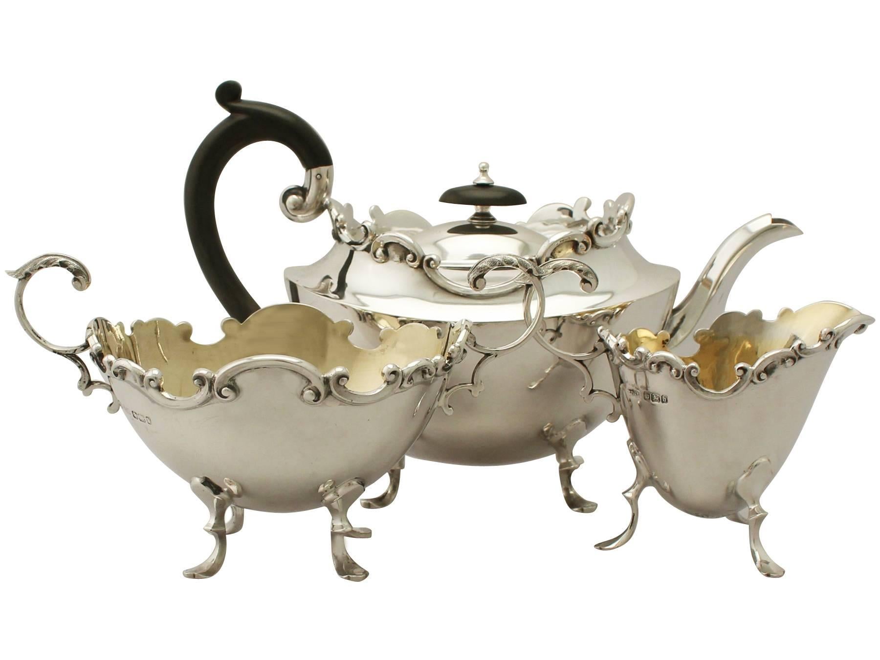 An exceptional, fine and impressive antique Victorian English sterling silver three-piece tea set/service, boxed; part of our silver tea ware collection.

This fine antique Victorian sterling silver three-piece tea service consists of a teapot,