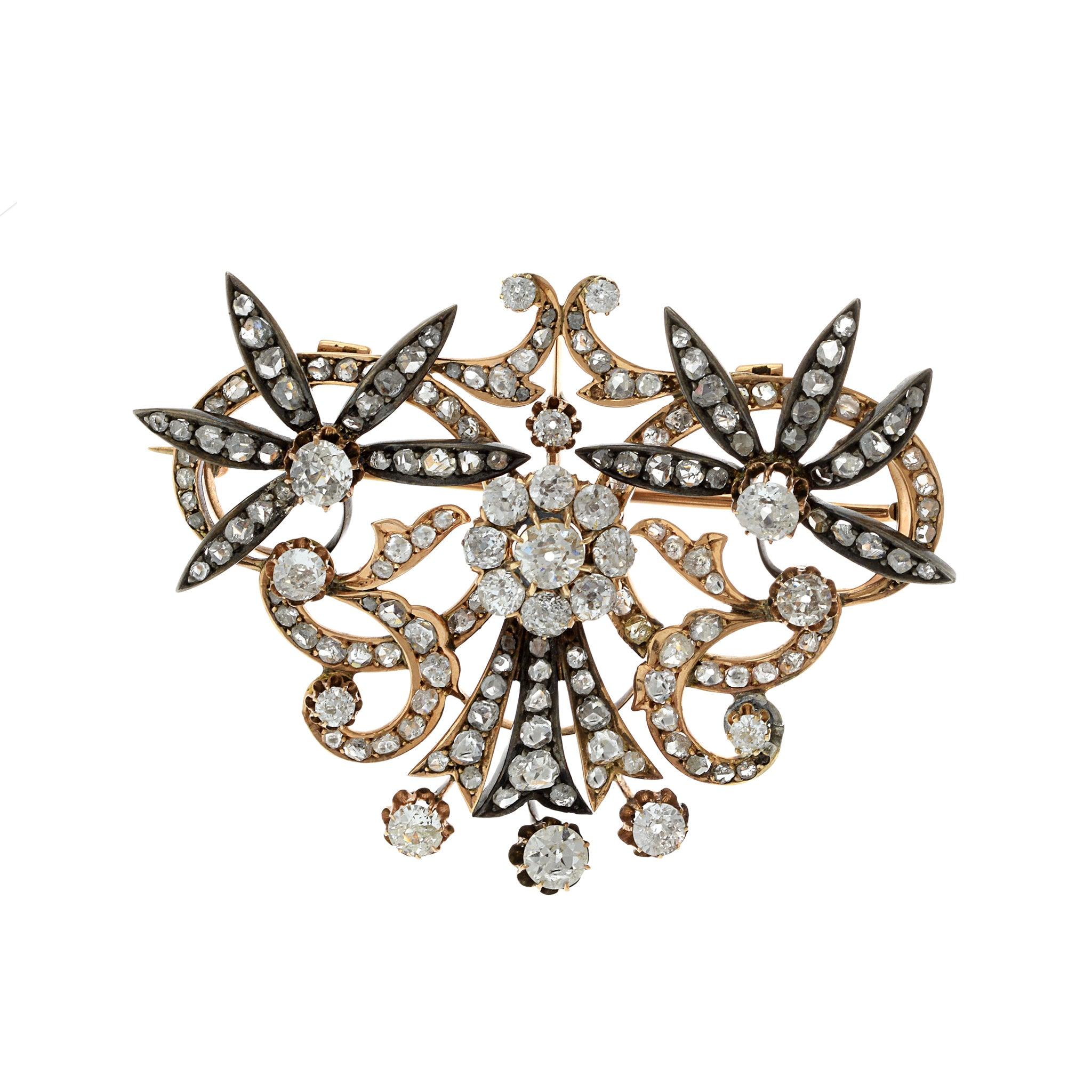 Elevate your style with our Rare Victorian Era Brooch. Crafted in 14 karat rose gold and sterling silver, this antique pin is adorned with a total of 8.50 carats of old European cut diamonds. Make a statement with this captivating piece that