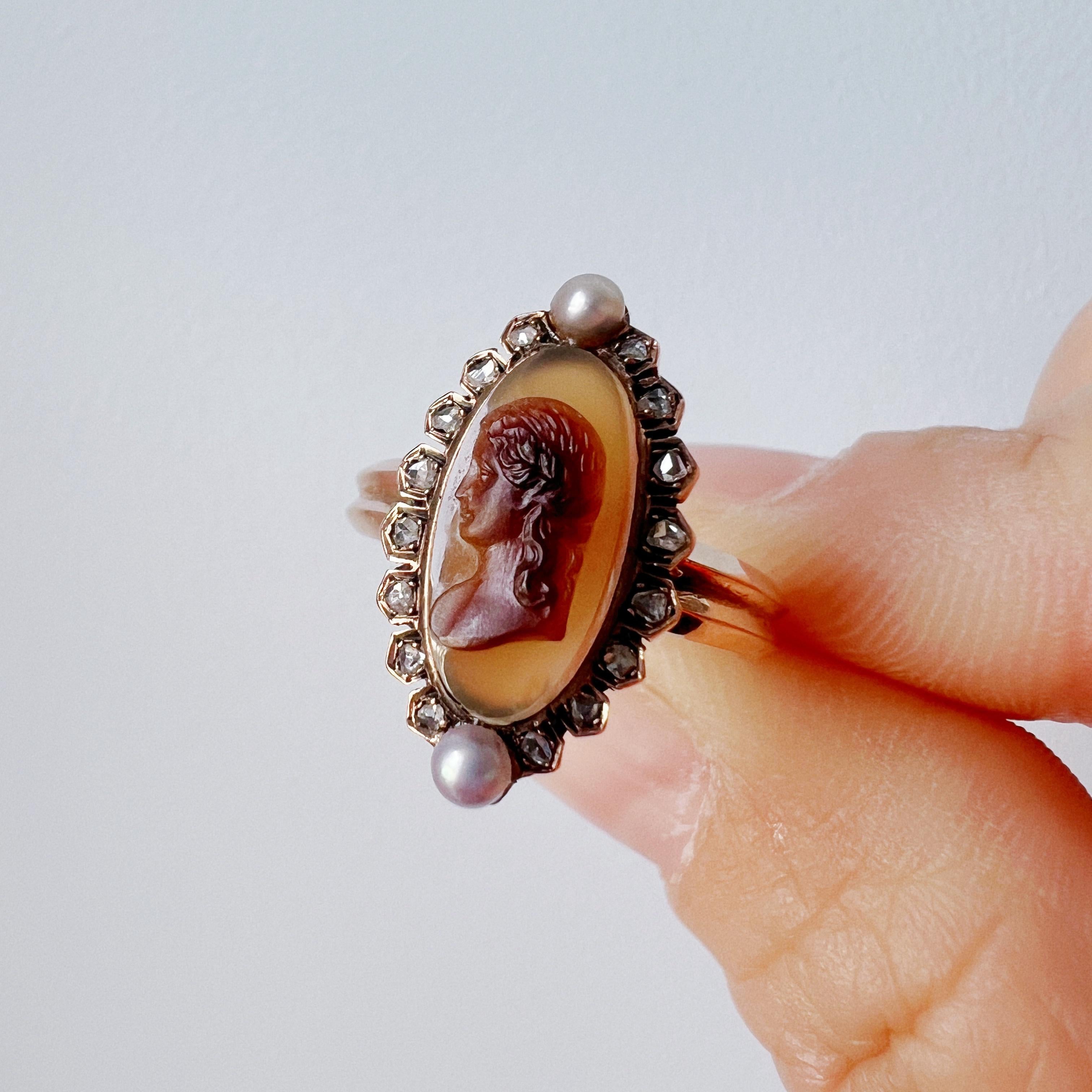 For sale a beautiful 18K gold ring dated back to the 19th century, the Victorian era. This exquisite ring features a stunning agate cameo of the delicate profile of a young girl. The natural dark and light hues of the brown color of the agate