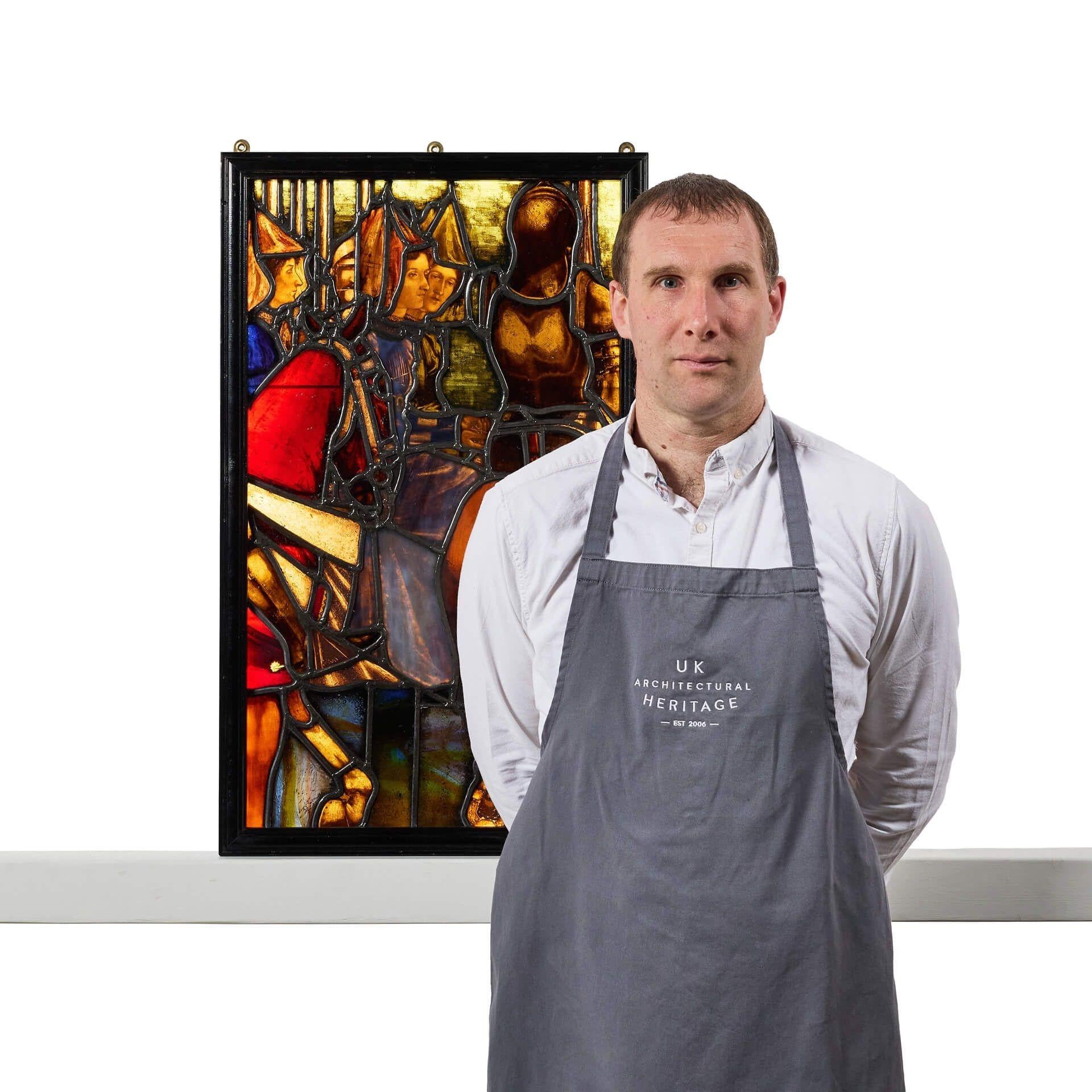 An antique Tudor style stained glass panel attributed to Williams, Gamon & Co dating to circa 1900. Burtonwood Brewery, Warrington. 

The scene depicts a pre-Raphaelite style and secular image, possibly depicting a day during the Field of the Cloth