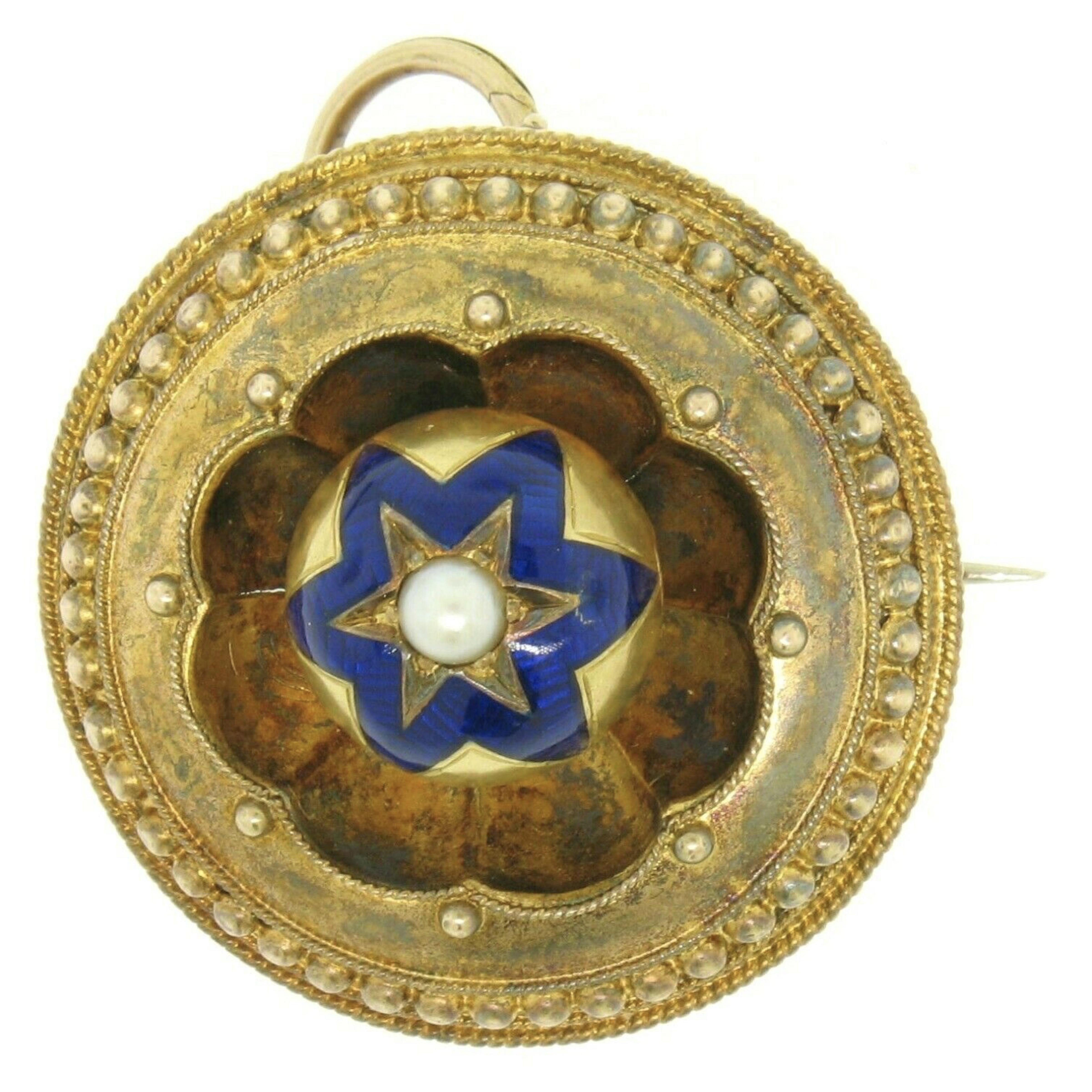 Here we have an amazing antique hair/picture locket from Victorian England. The piece is solid 15k yellow gold and has its original patina in tact. The piece has an Etruscan style design with a six pointed, champlevé, royal blue enamel work star.