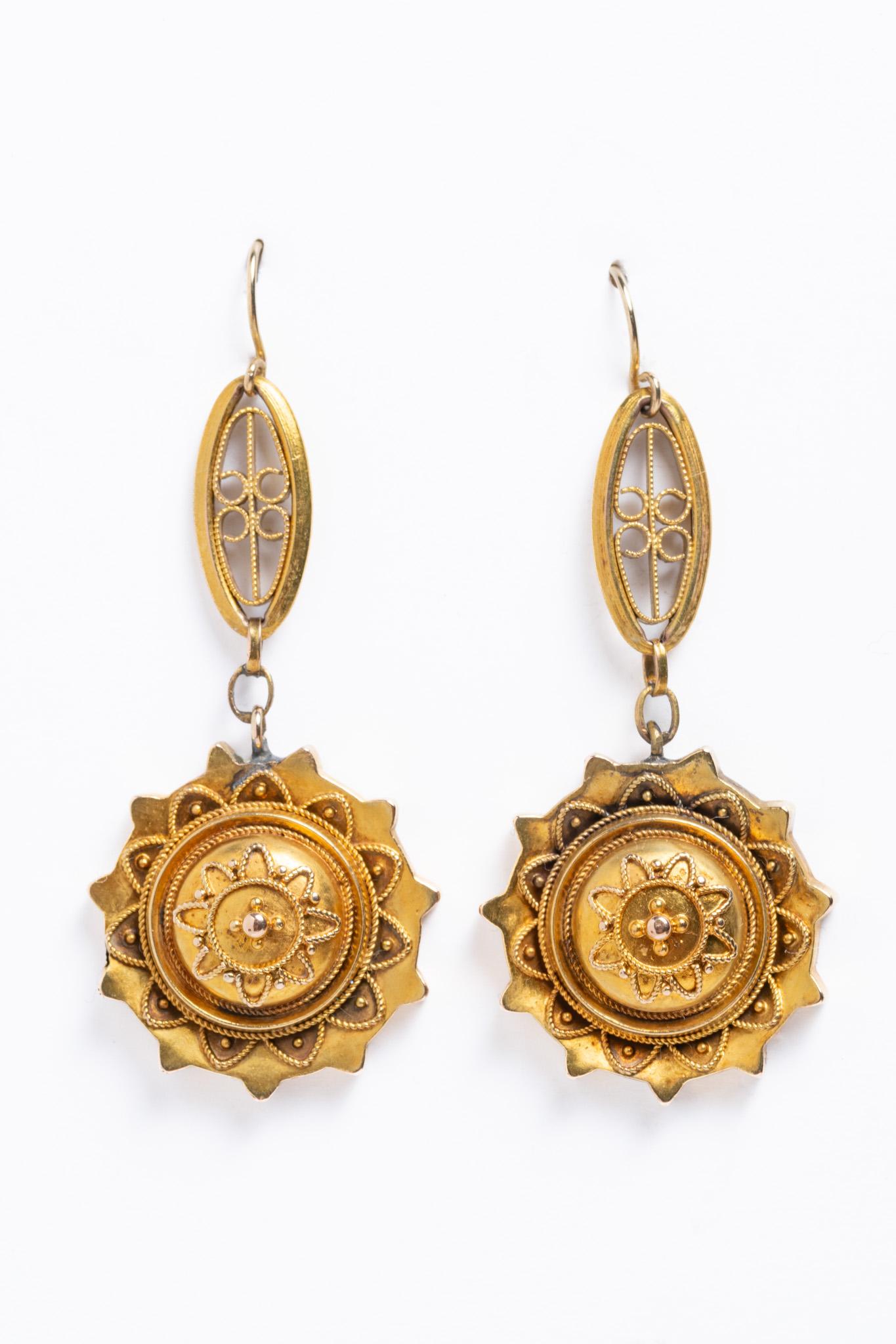 Truly exquisite and rare pair of antique 14ct gold Etruscan Revival style drop earrings made circa 1880. The top of the earrings is made up of open delicate filigree detailing. This pair of earrings is beautifully designed with a Victorian floral