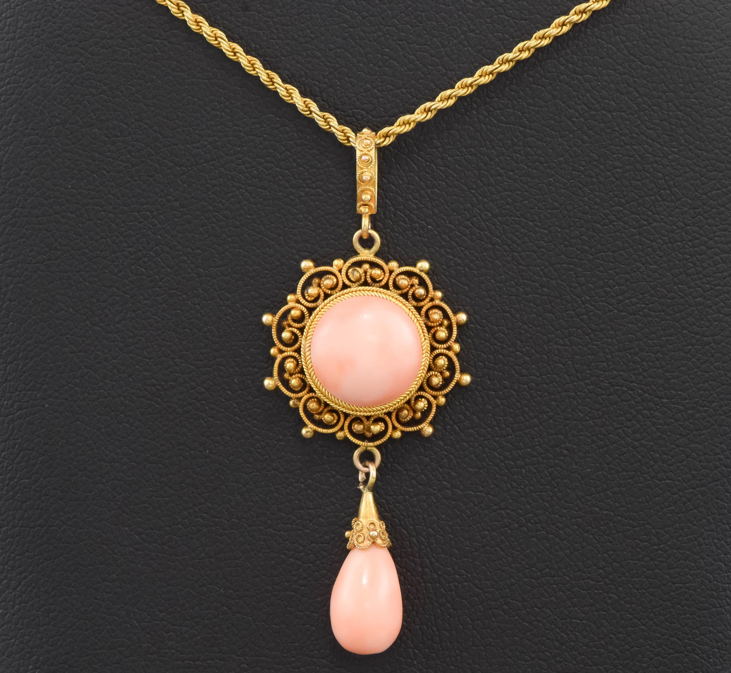 Offered is a lovely Victorian period angel skin coral necklace done in an Etruscan revival style.  It features beautiful detail work; the pendant is original to the chain, which is always extra nice.

I find no hallmarks but have tested the gold to