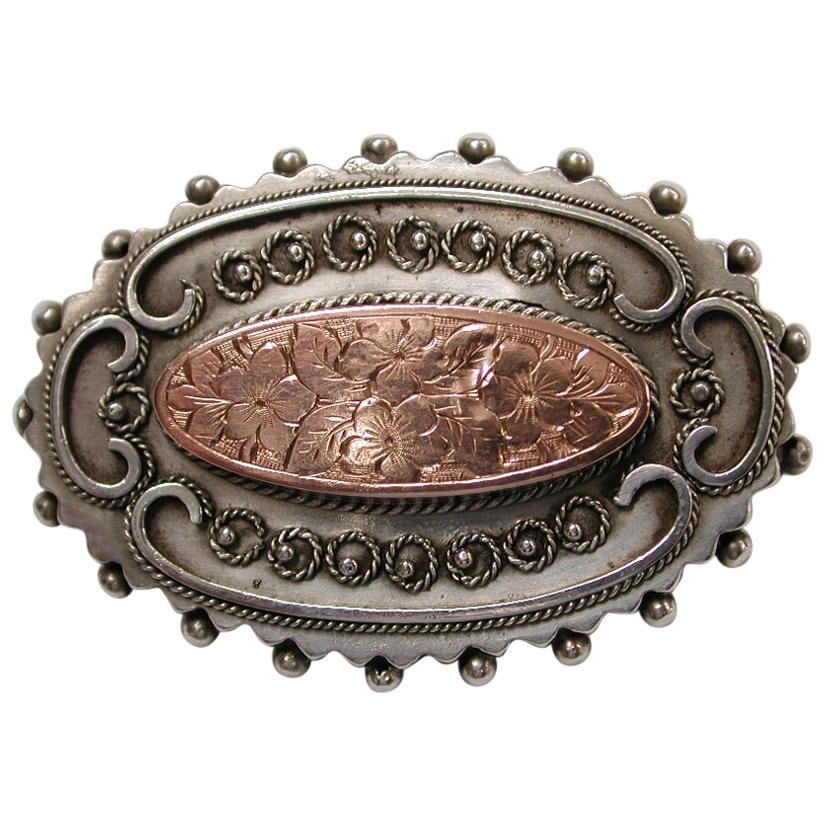 Antique Victorian Etruscian Silver Brooch with Engraved Oval 9 Carat Centre 1880 For Sale