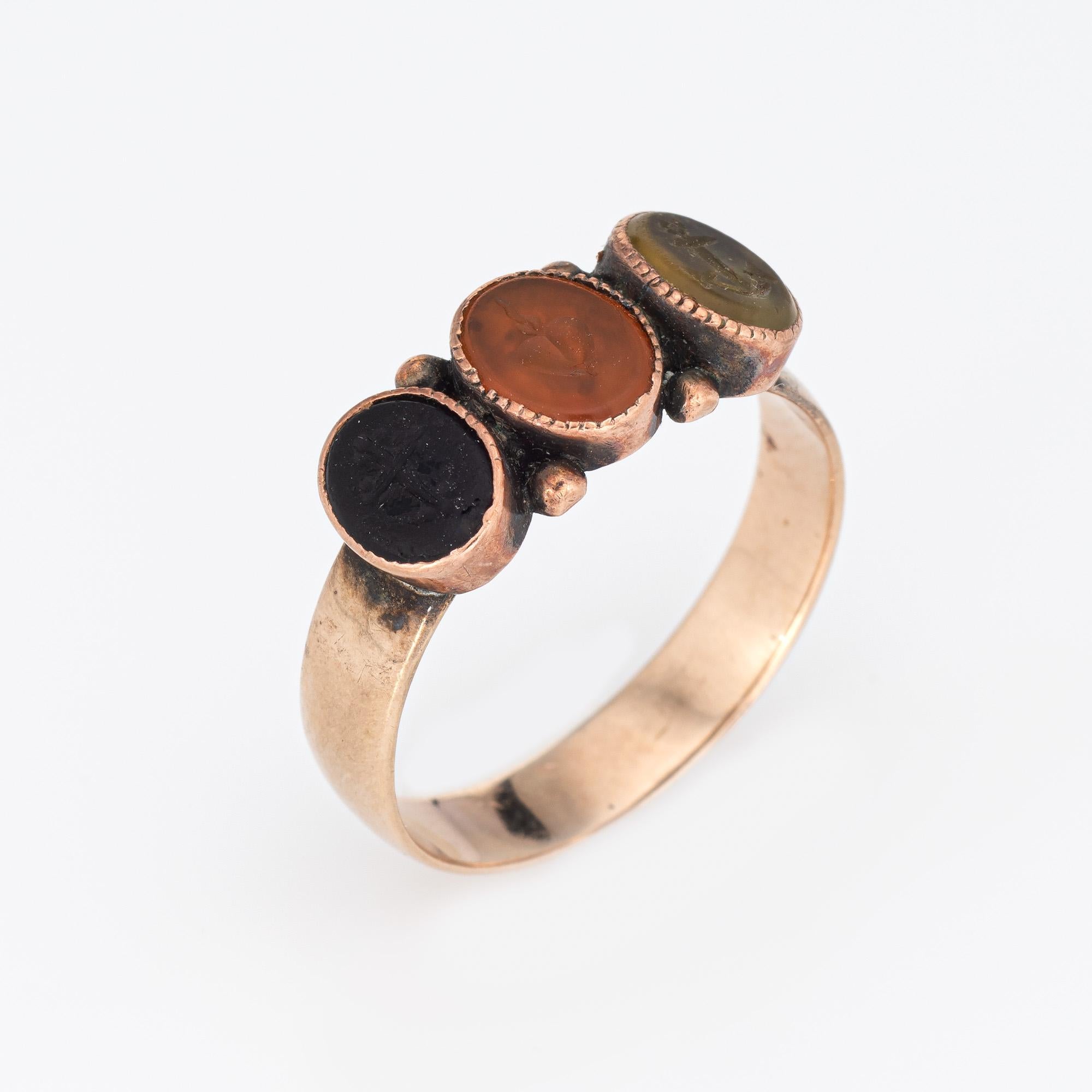 Finely detailed Victorian era 'Faith, Hope & Love' ring (circa 1880s to 1900s), crafted in 10 karat rose gold. 

Black, orange and green stones measure 6mm x 5mm. The stones are in good condition with wear evident under a 10x loupe. 

Faith is