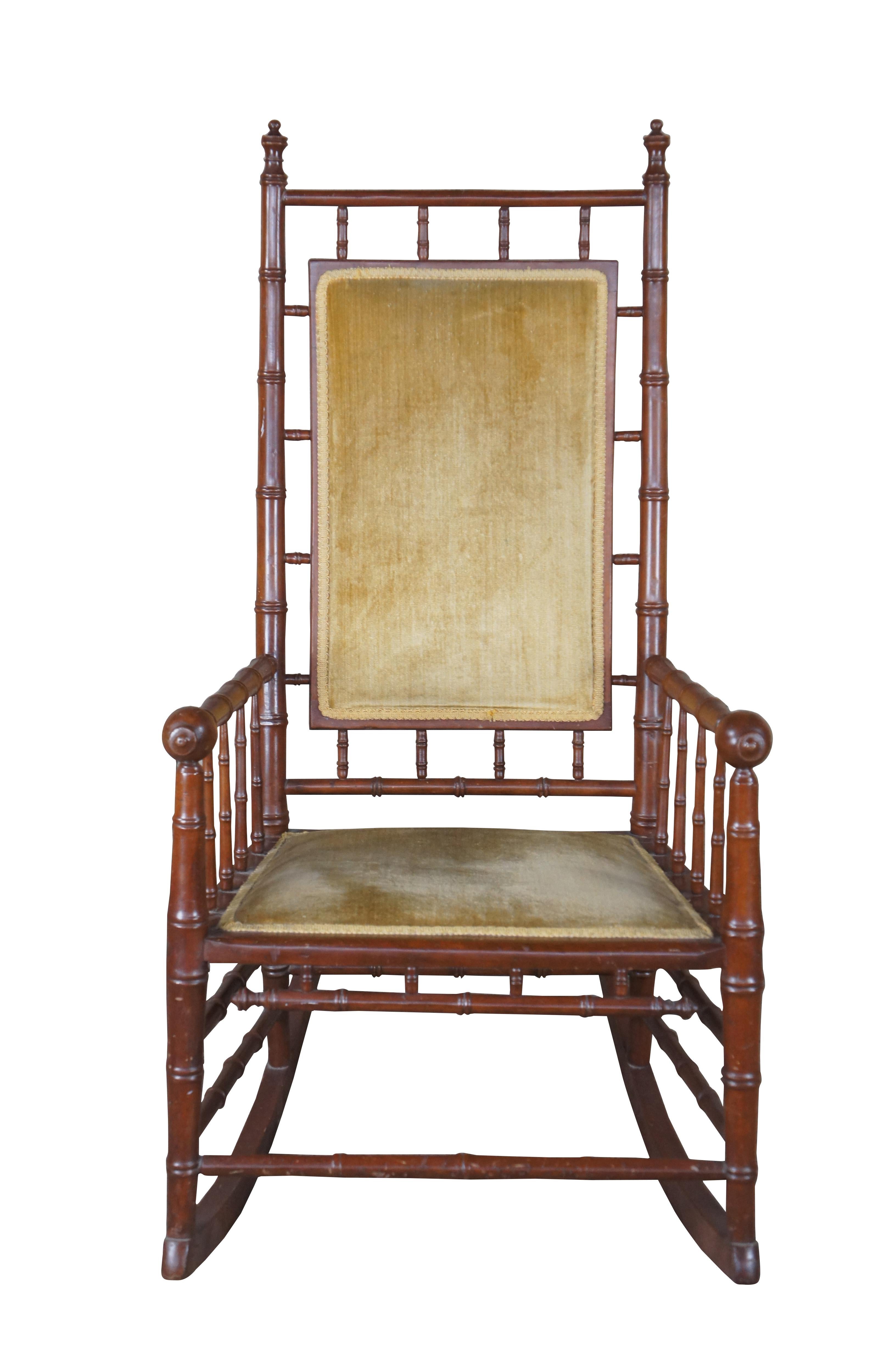 Late 19th Century Victorian Faux Bamboo Rocker.  Features a mahogany frame and velvet seat.

Dimensions:
23