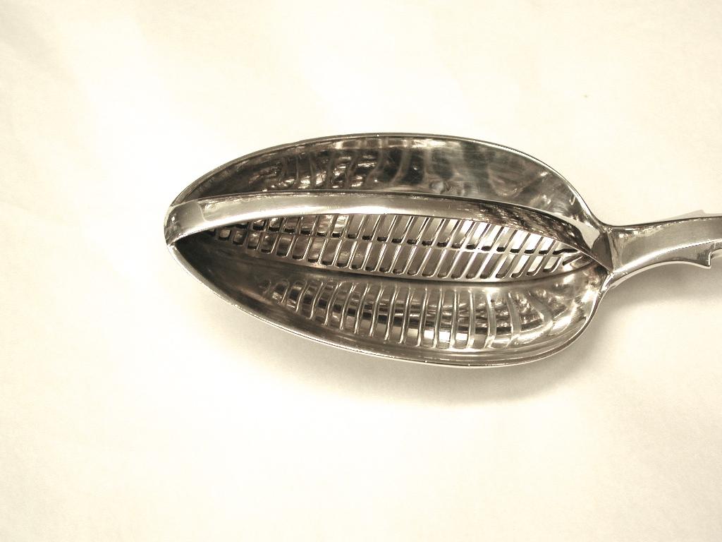 Antique fiddle pattern slotted serving spoon, made by William Eaton of London.
This is an extremely heavy gauge serving spoon and was used to serve vegetables,
 and strain away the juices that collected in the serving bowl.