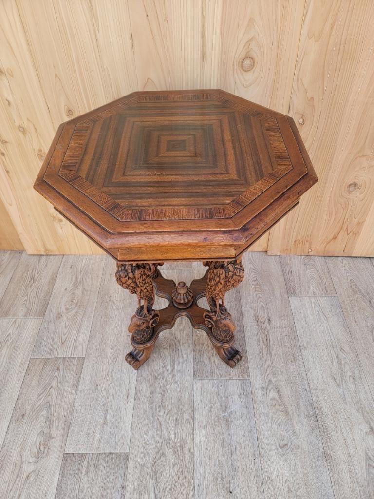 Antique Victorian finely-carved figural crane leg walnut octagon top cocktail table.

Antique Victorian finely-carved walnut octagonal top cocktail/side table. The incredibly detailed hand-carved cranes at each leg are beautifully sculpted, with