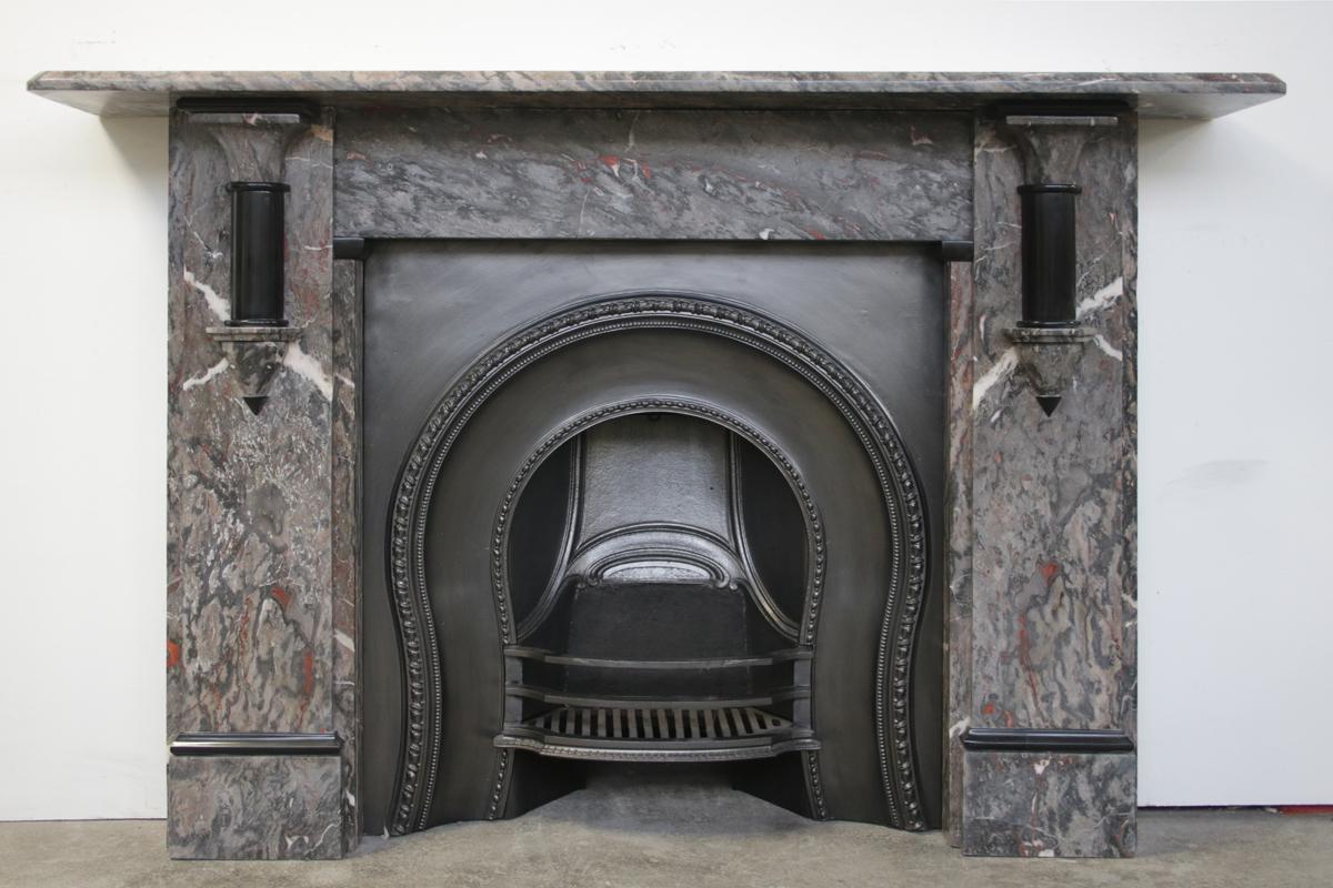 Antique Victorian fireplace surround in grey Ashburton marble with Belgium black marble demi pillars and decoration.

Pictured with an original cast iron arched grate, sold separately.

For detailed sizes please see the size diagram within the