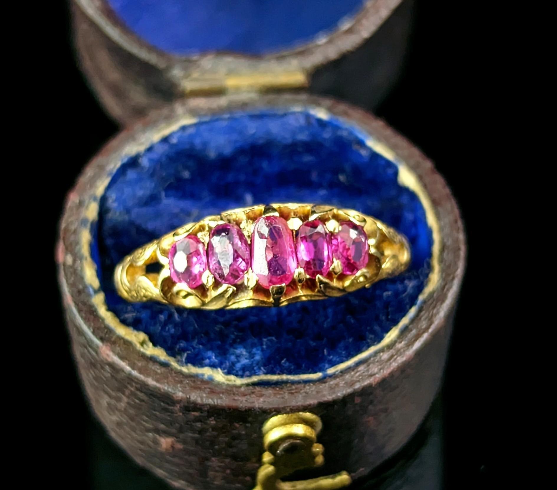 You can't help but be mesmerised by this antique Ruby rings magical rich charm.

It has a slightly mystical feel to it with the tall oval cut rubies and decorative rich gold shoulders.

The rubies are a lovely deep pinky red hue and they are really