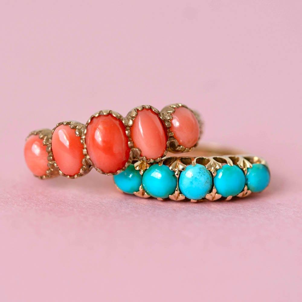 Our antique Victorian ring features five turquoise cabonchon gemstones that are set in a row on a band made of 18-carat gold. The vibrant blue-green color of the turquoise stones is complemented by the warmth and richness of the gold, creating a