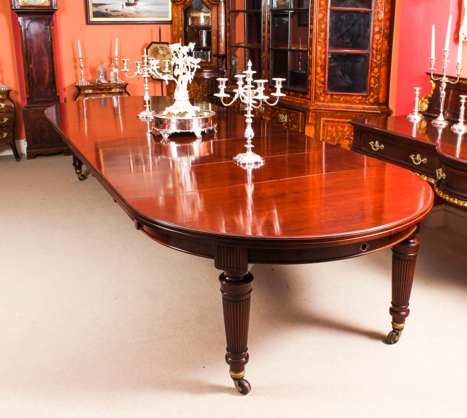 This is a magnificent antique Victorian solid mahogany dining table which can seat fourteen diners in comfort and is also ideal for use as a conference table. It is circa 1870 in date.

This beautiful table is circular in shape when all the leaves