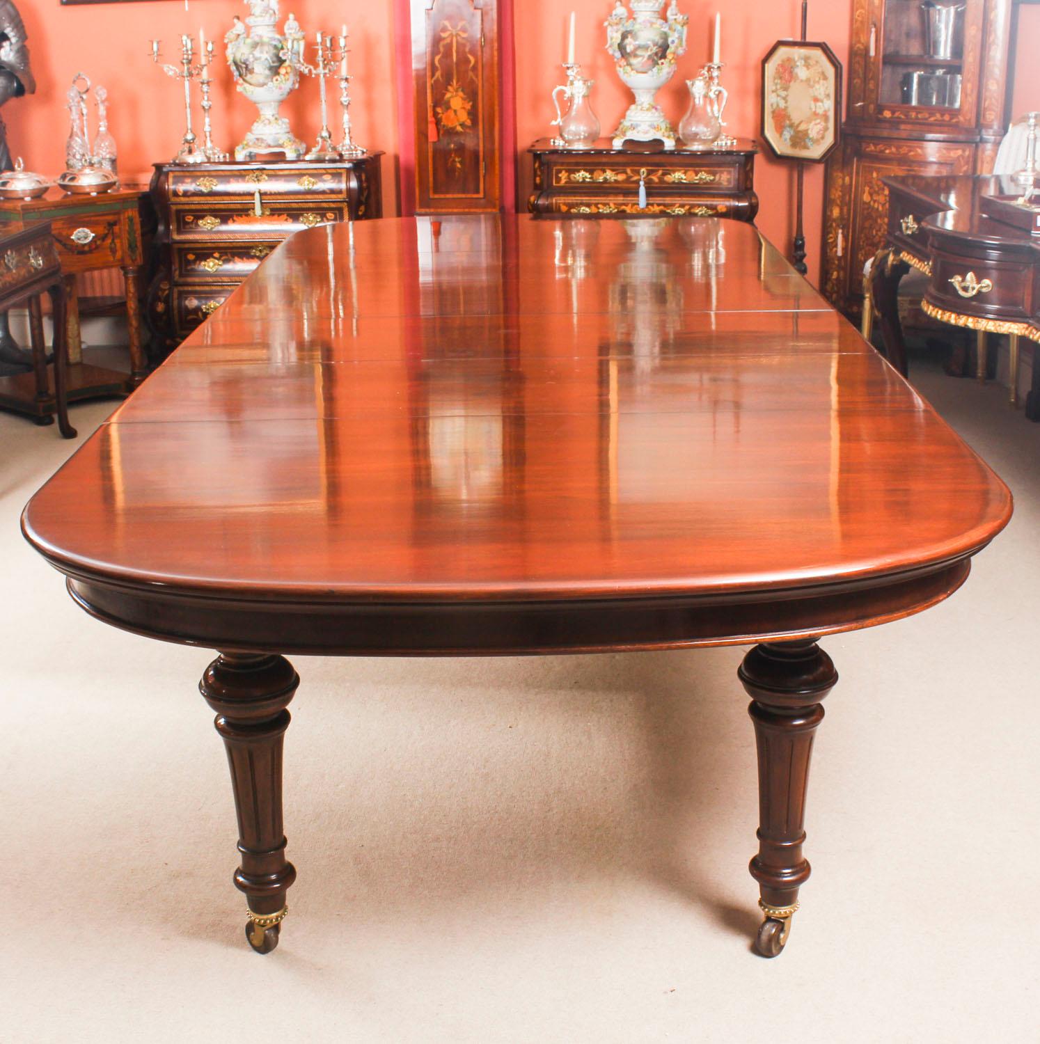 This is a magnificent antique Victorian solid mahogany D-end dining table which can seat twelve diners in comfort and is also ideal for use as a conference table, circa 1870 in date.

This beautiful table is in stunning flame mahogany and has four