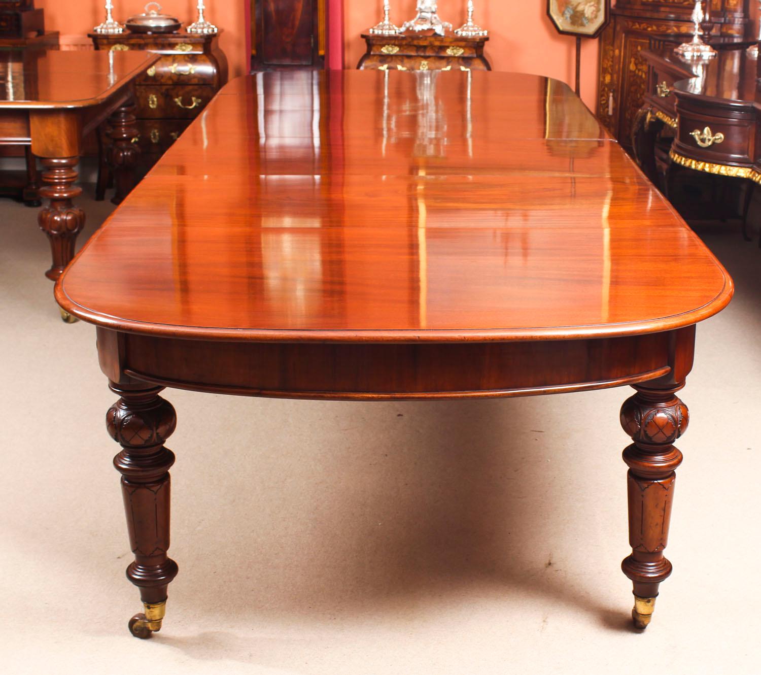 This is a magnificent antique Victorian solid mahogany D-end dining table which can seat fourteen diners in comfort and is also ideal for use as a conference table, circa 1870 in date.
 
This wonderful table is in stunning flame mahogany and has