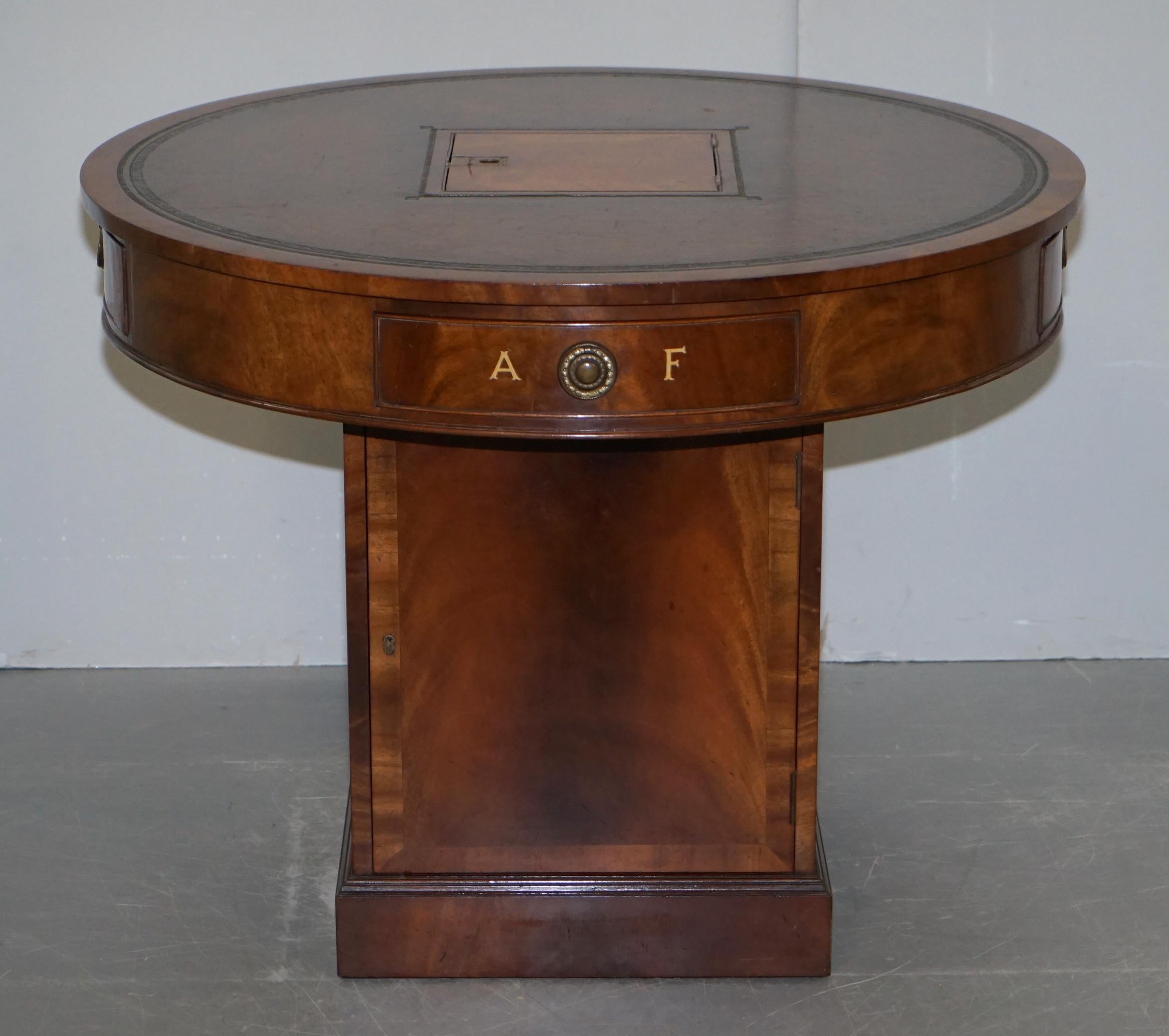We are delighted to offer for sale this exquisite Victorian circa 1880 revolving flamed mahogany with hand dyed brown leather top “Rent” table

This is a very fine piece of antique furniture indeed. The originals date back to the late 18th century