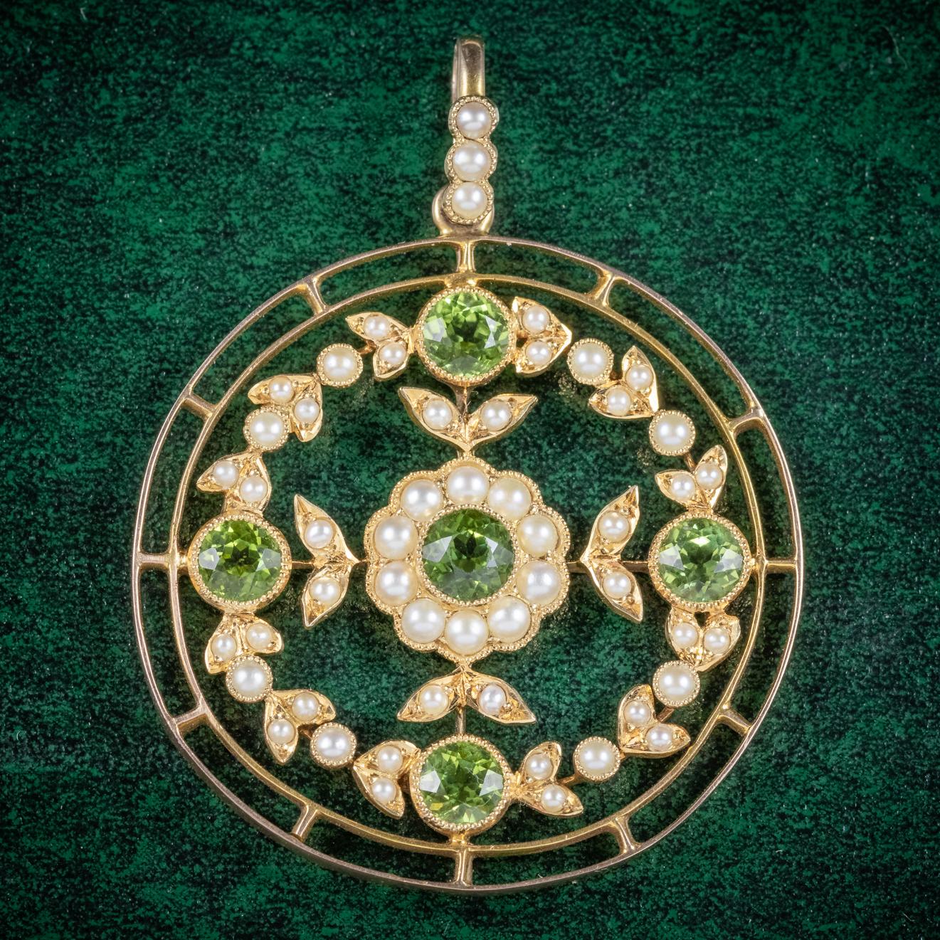 A fabulous antique Victorian floral pendant C. 1900, adorned with five rich green Peridot’s and decorated in lovely natural Pearls. 

The largest Peridot is 0.50ct and crowned in the centre of a flower with a halo of Pearl petals. The rest of the