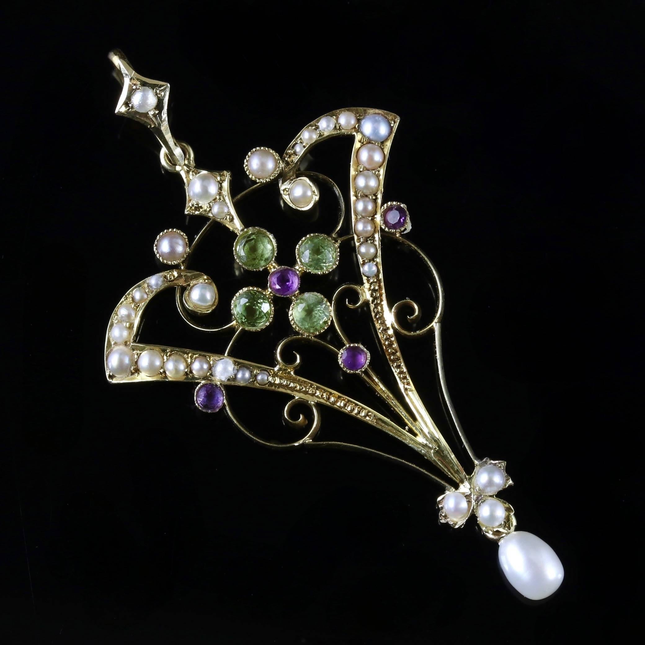 This Victorian 15ct Yellow Gold Suffragette pendant is beautiful, Circa 1900. 

The pendant is adorned with a 4 green Peridots that surround the Amethyst in the centre. The Pearls are decorated all round the pendant in a floral style gallery, which