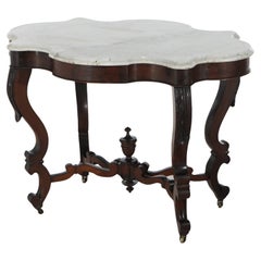 Ancienne table victorienne à plateau en forme de tortue en noyer sculpté de feuillages et marbre biseauté C1890