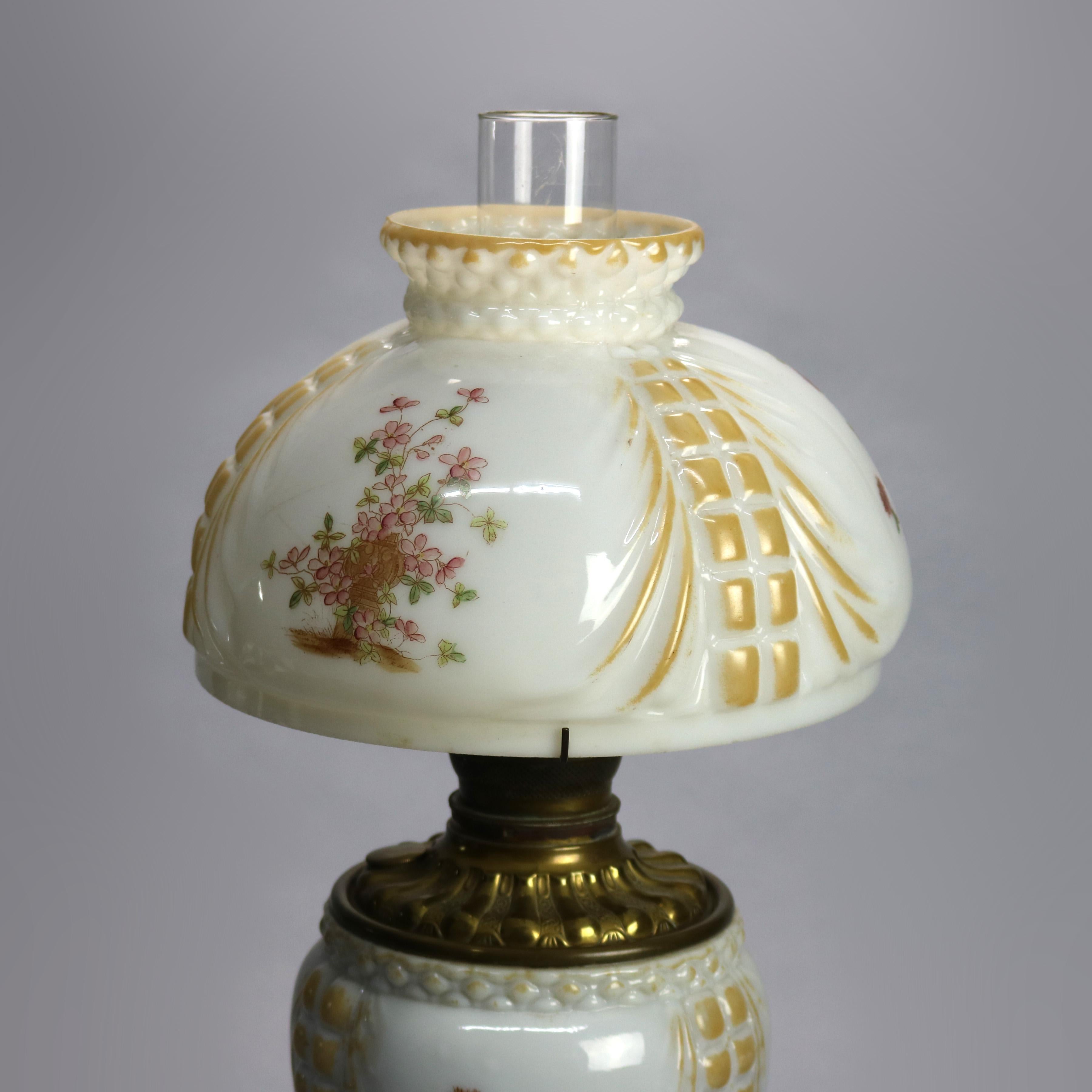 An antique Victorian Fostoria gone with the wind parlor lamp offers floral painted shade and font on foliate cast base, electrified, Circa 1890

Measures: 21.5