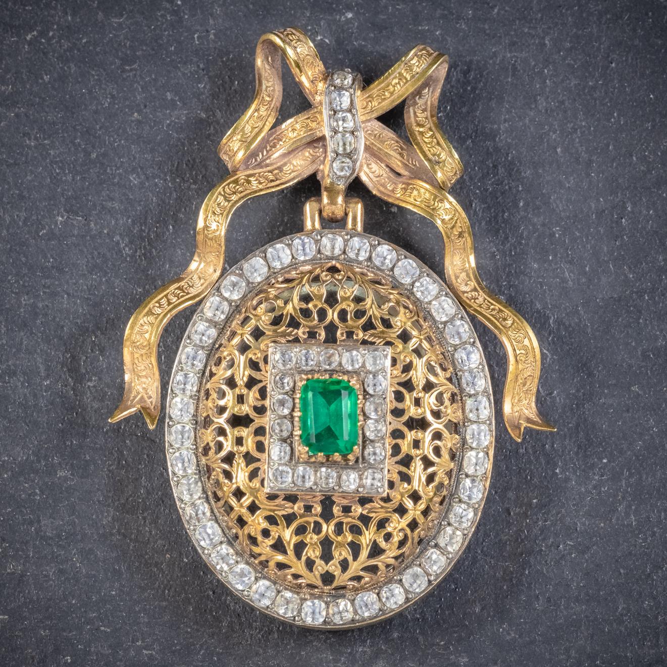 A truly fabulous antique French Paste stone locket from the Victorian era, Circa 1900. 

The lovely oval gallery is set with an emerald cut green Paste stone in the centre with two outer borders of white Pastes that simulate Diamonds. 

The lockets