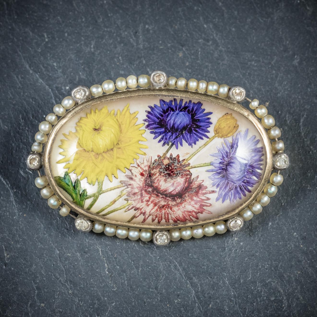 This breathtakingly beautiful antique French flower brooch is from the Victorian era, Circa 1900

A beautiful bouquet of hand painted flowers adorns the centre which is overlaid with Essex Crystal giving the image a fabulous three dimensional