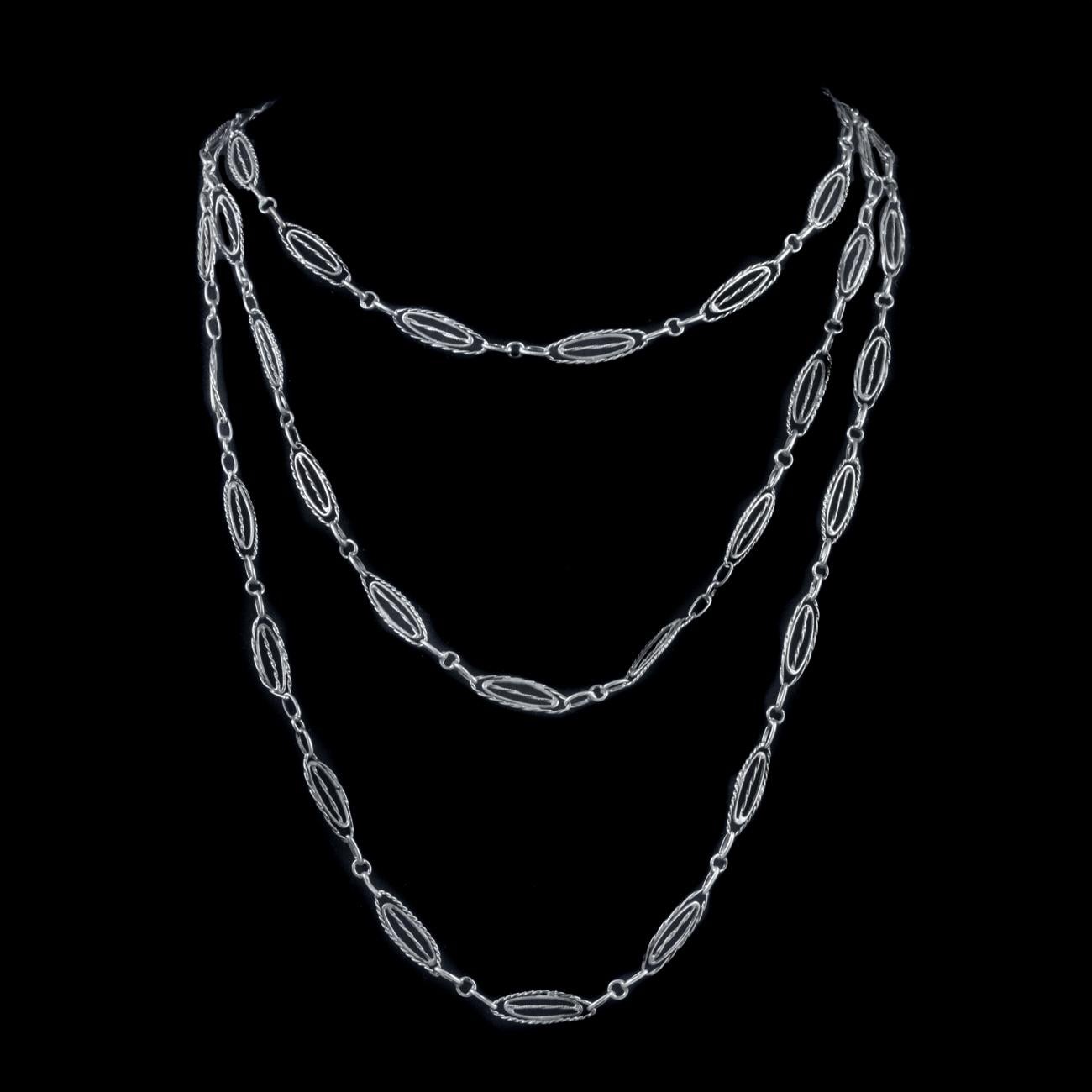 This beautiful Antique Victorian French guard chain has been commissioned in Silver. It features elaborate engraved double oval links spaced around the chain.

The chain features a large spring ring clasp to attach a pendant.

A lovely chain which