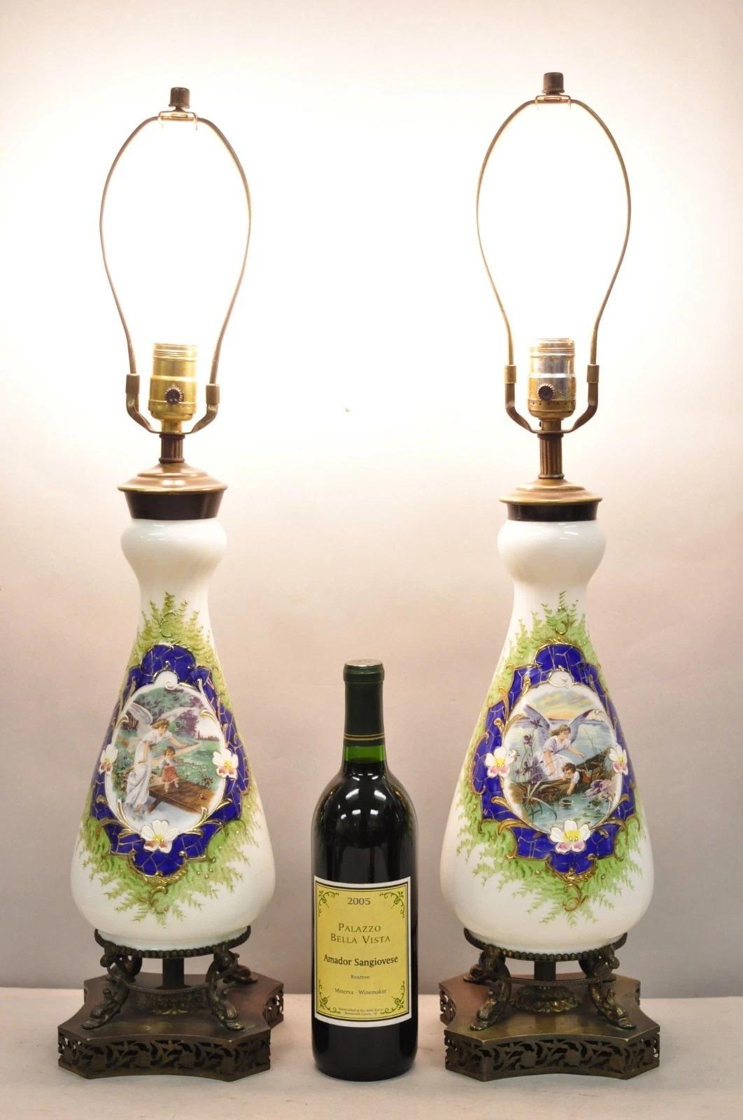 Antique Victorian French Style Hand Painted Angel and Child Glass Table Lamps Raised on Brass Dolphin Base - a Pair. Circa Early 20th Century. Measurements: 27.5