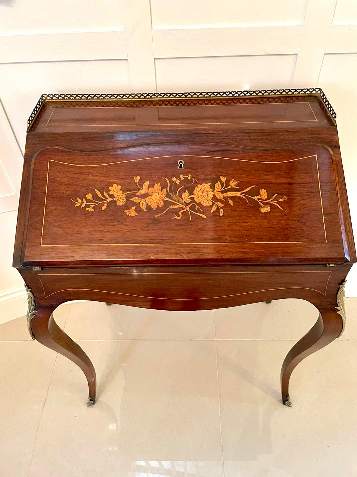 Antique Victorian French inlaid rosewood freestanding bureau/desk having the original gilt metal gallery above a devine shaped inlaid marquetry fall opening to reveal a fitted interior with three drawers and a sliding well, freestanding polished