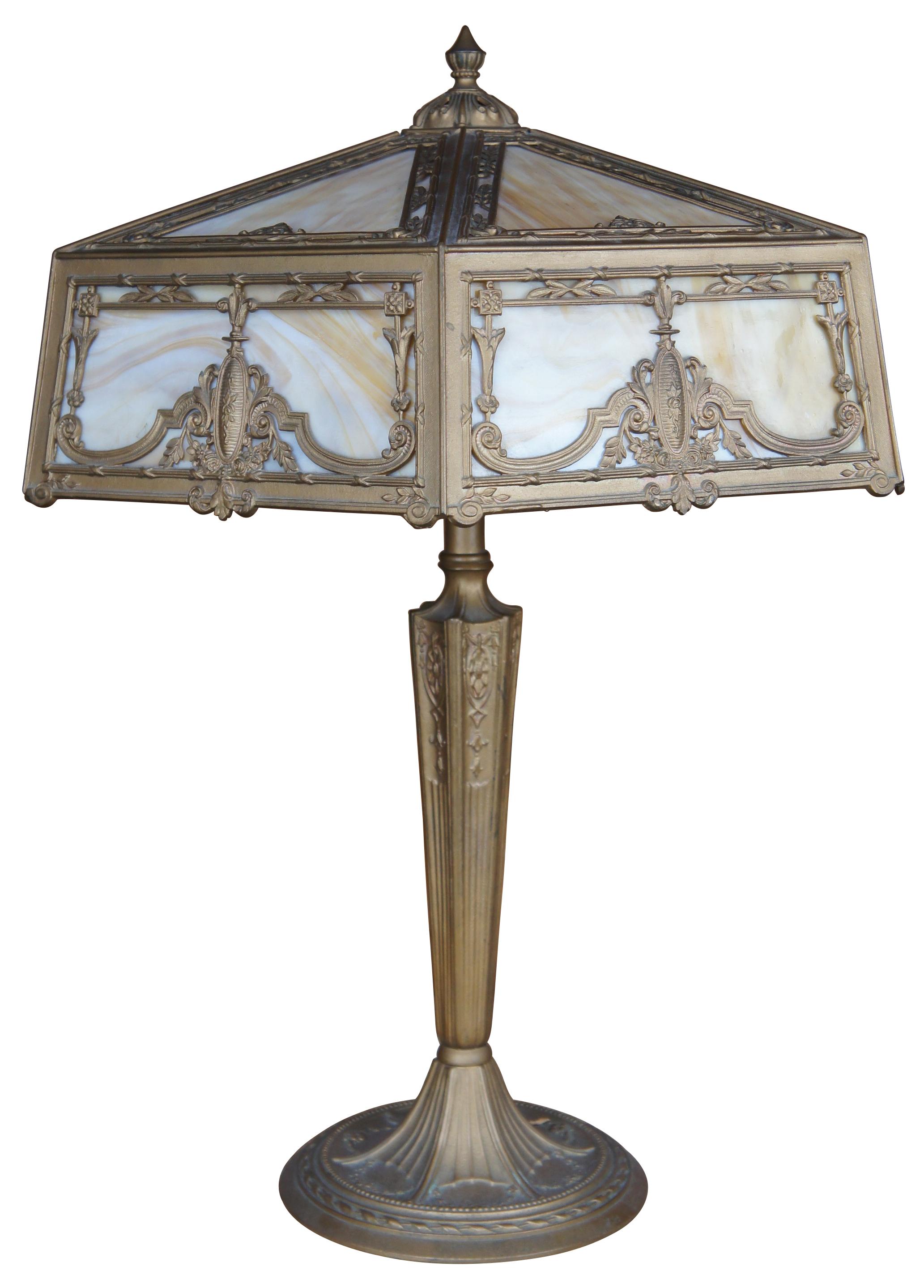 Antique arts and crafts cast iron library, desk or parlor lamp featuring three lights with hexagon form slag glass reticulated filigree shade and neoclassical styling. Size: 25
