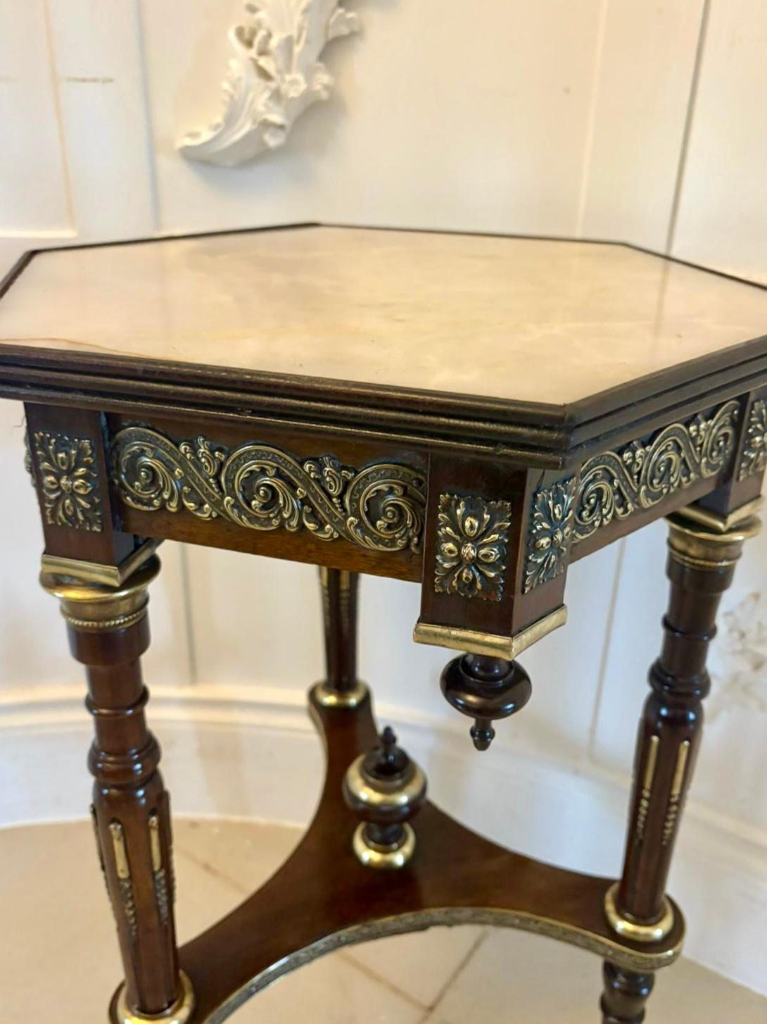 Antique Victorian French quality mahogany and gilded brass marble top lamp table having a quality marble hexagonal shape top with a reeded edge supported by a mahogany frieze with ornate gilded brass mounts, turned finales, 3 turned reeded tapering