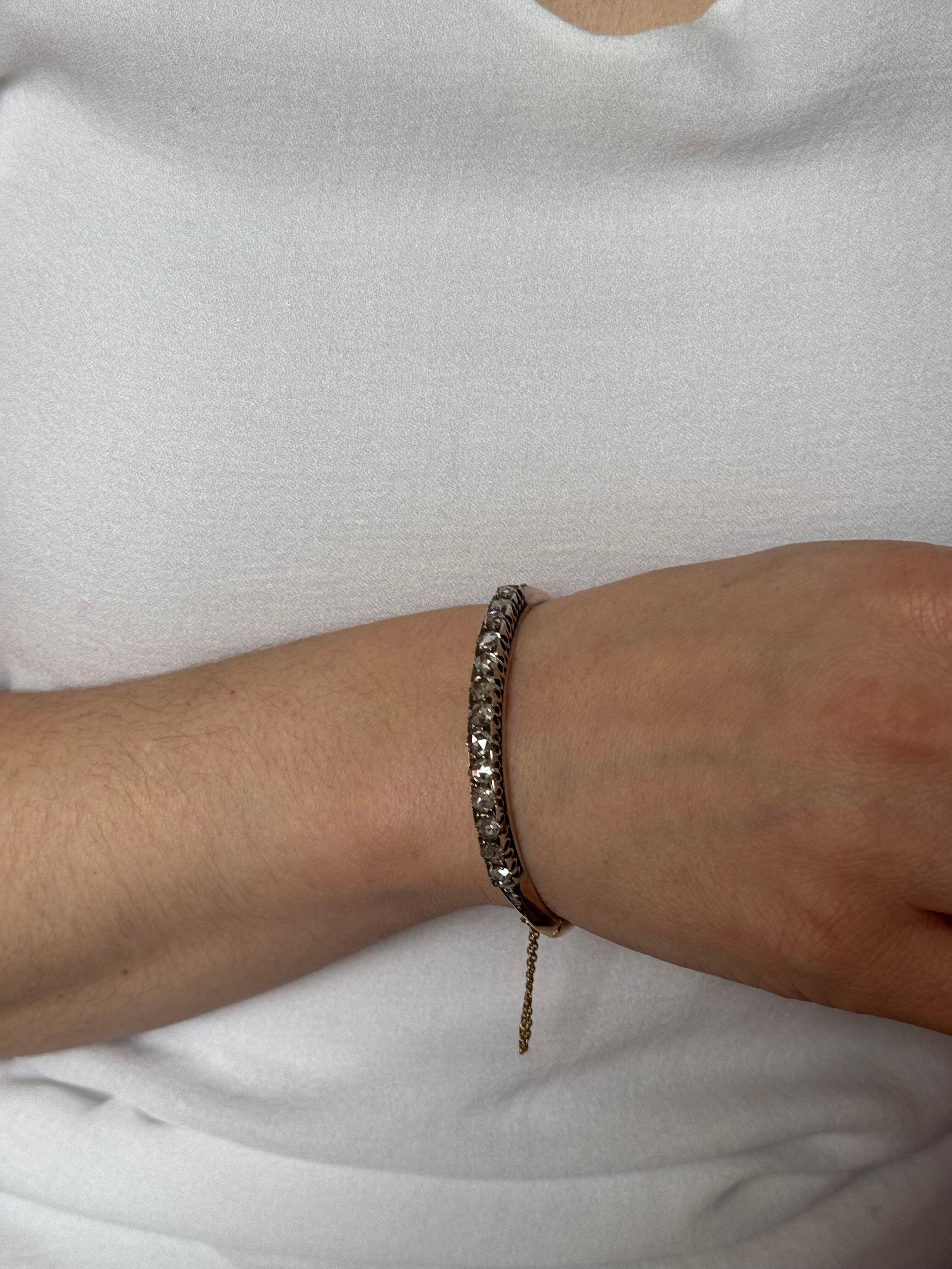Antique Victorian 18k rose gold and silver bangle bracelet, adorned with 13 rose cut diamonds - each stone approx. 0.25ct, total 3.25cts. Made in France.
Bracelet will fit an approx. 7