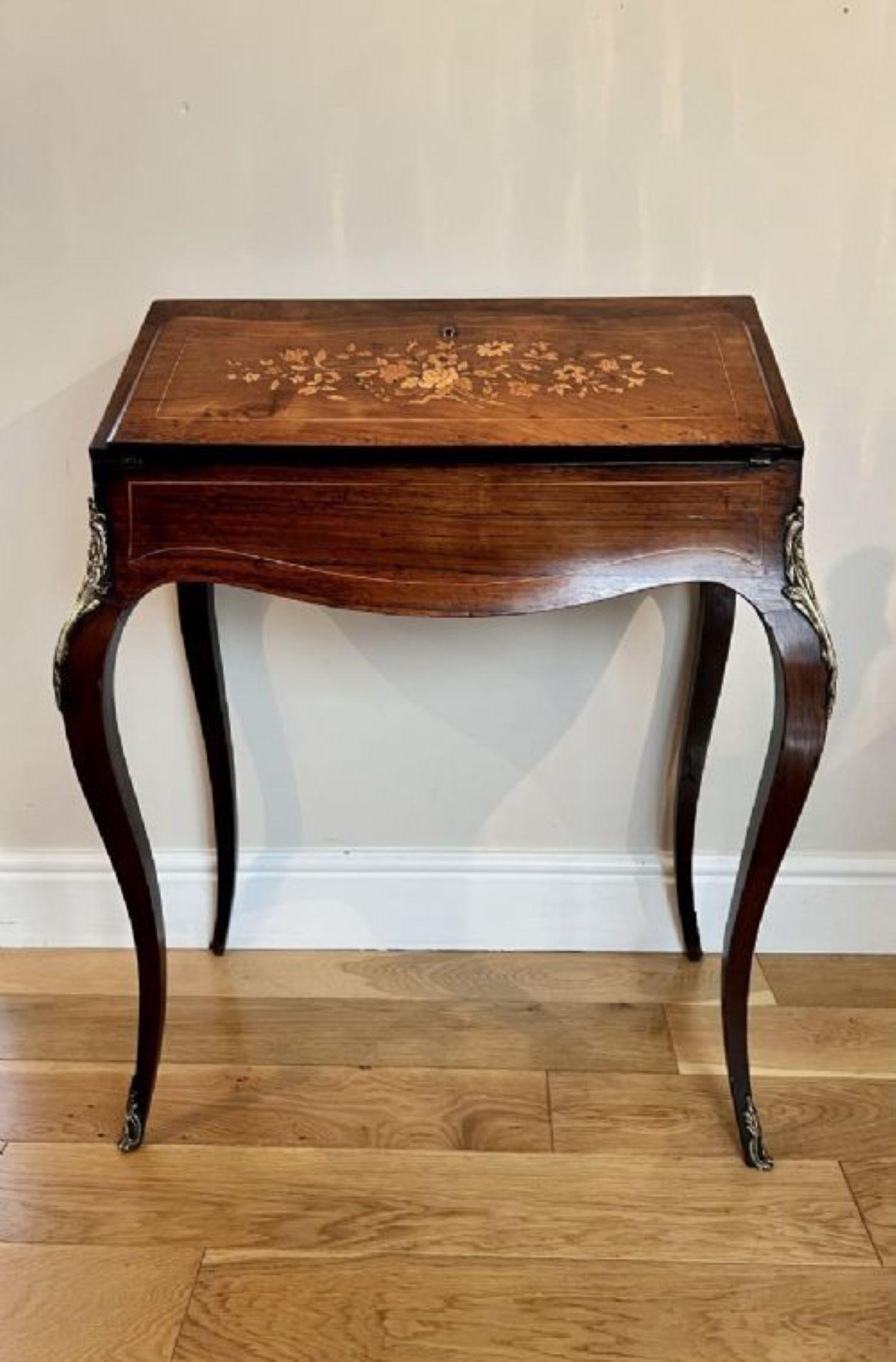 Antique Victorian French rosewood marquetry inlaid bureau having a quality antique Victorian French rosewood marquetry inlaid bureau opening to reveal fitted interior consisting of a leather pull out, two drawers and one large drawer compartment to