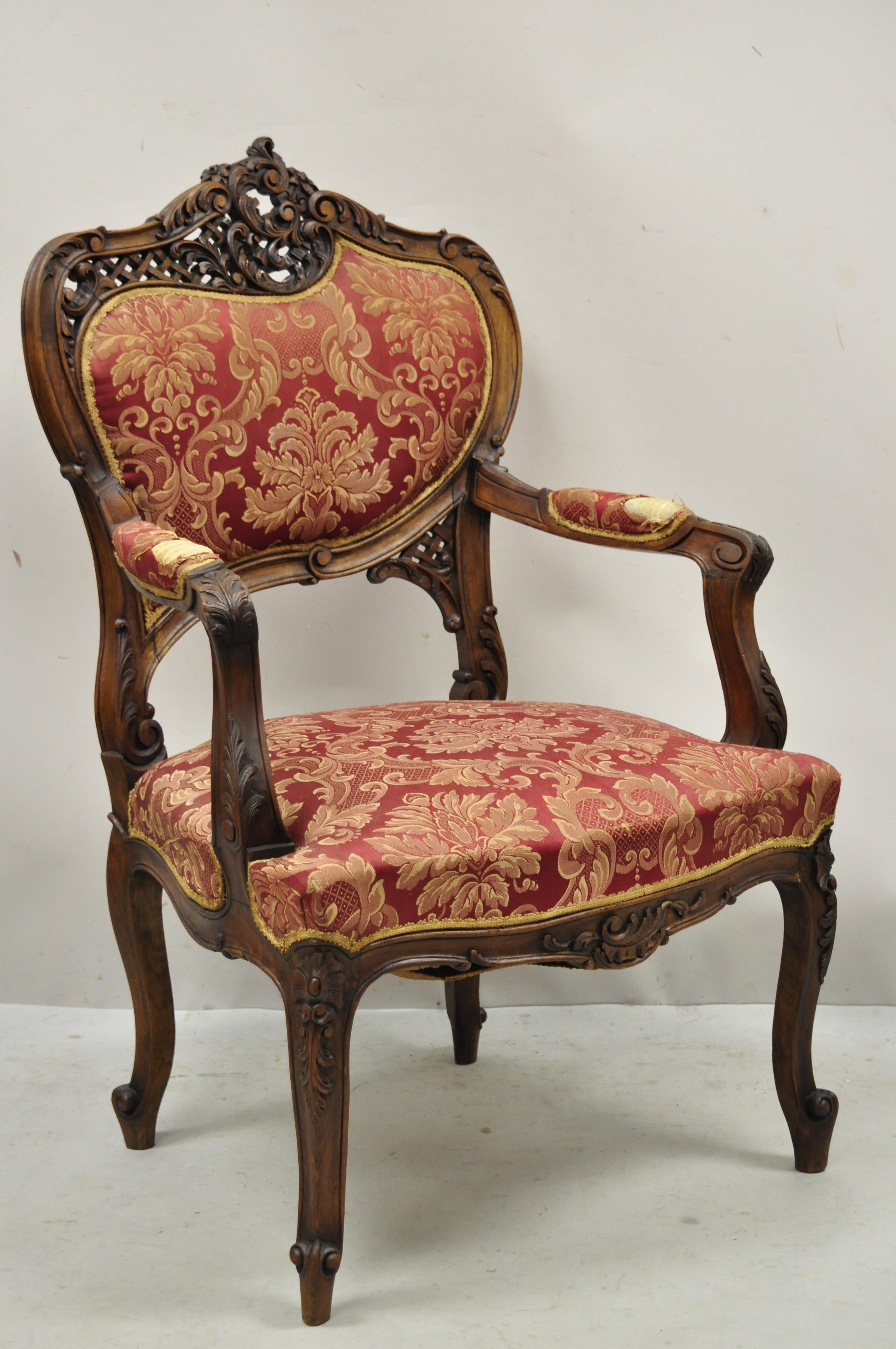 Antique Victorian French style finely carved Mahogany wood parlor arm chair. Item features solid wood frame, beautiful wood grain, nicely carved details, cabriole legs, very nice antique item, great style form. Circa early 1900s. Measurements: 39.5