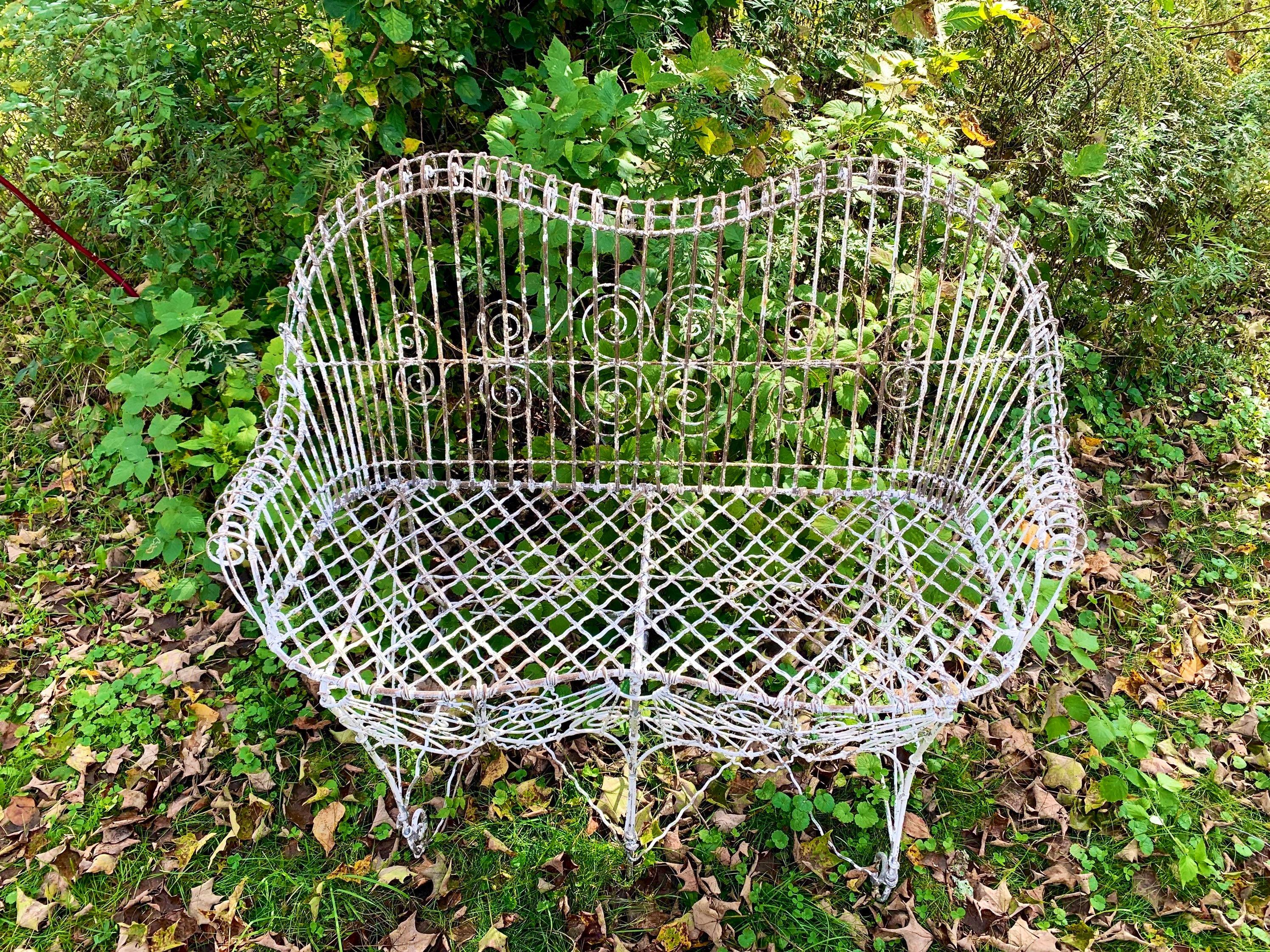 Antique Victorian garden settee loveseat.

Intricate Wrought Iron Wireworks Detail
Perfect for any garden or terrace
In stock and ready to ship today.