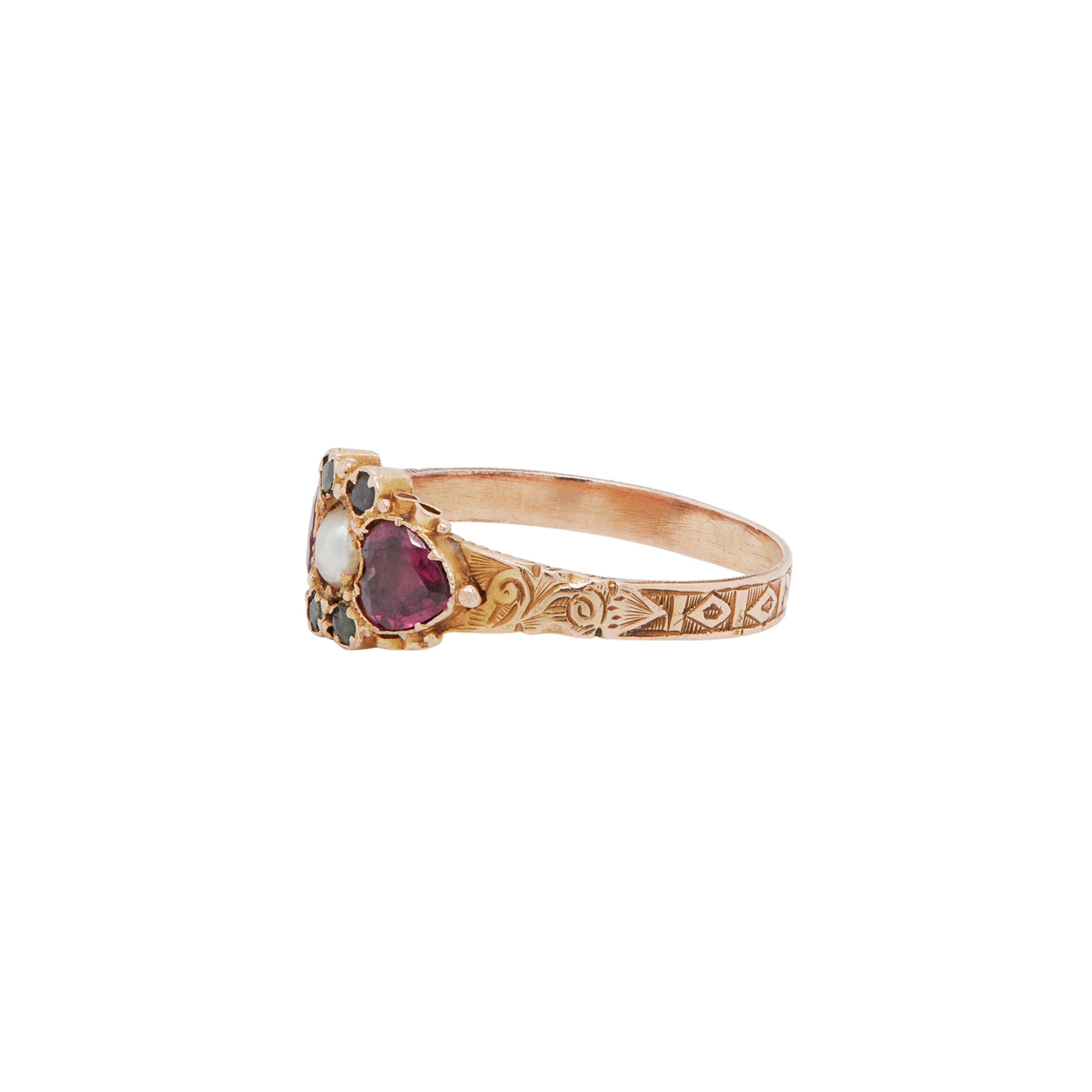 Full of Early Victorian charm, this 15 carat yellow gold dress ring showcases an absolutely fabulous combination of colourful gemstones and intricate hand carved details.

The fabulous ring is beautifully designed with ornate detailing to the top
