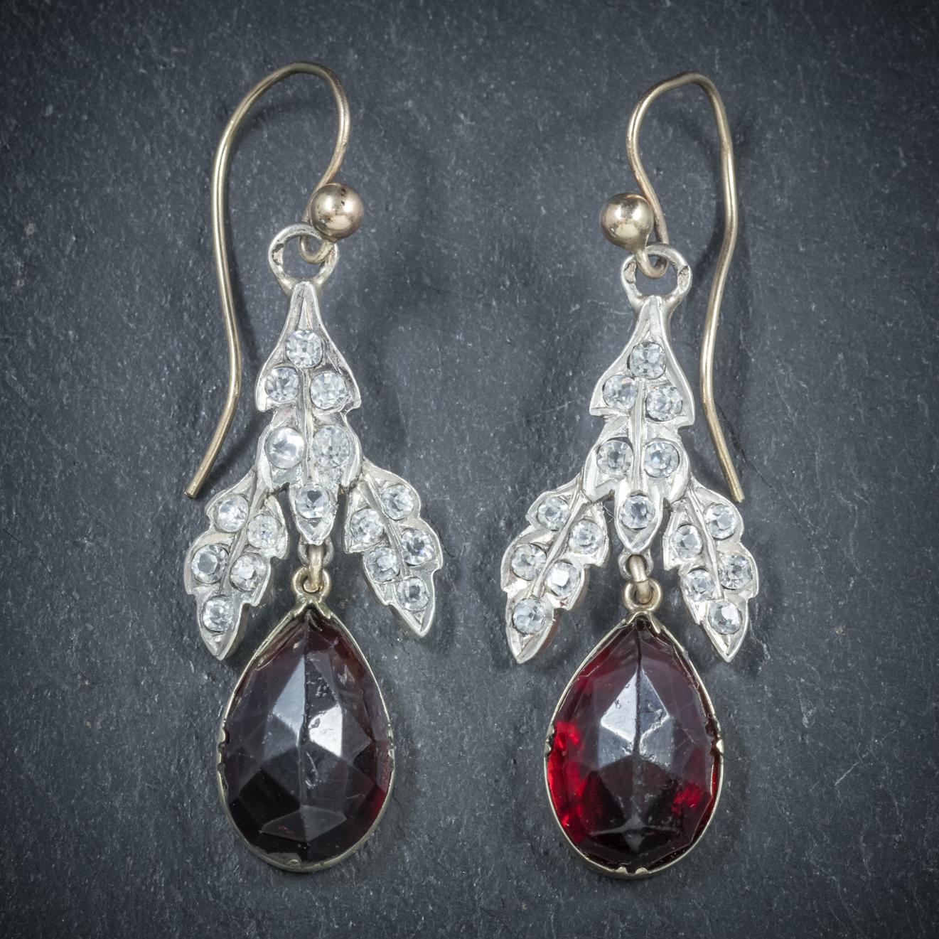 These stunning antique Garnet drop earrings are Victorian, Circa 1880

The central gallery is decorated in old cushion cut Crystals leading to a beautiful 5ct Garnet set in a closed backed 18ct Yellow Gold gallery 

The central gallery is set in
